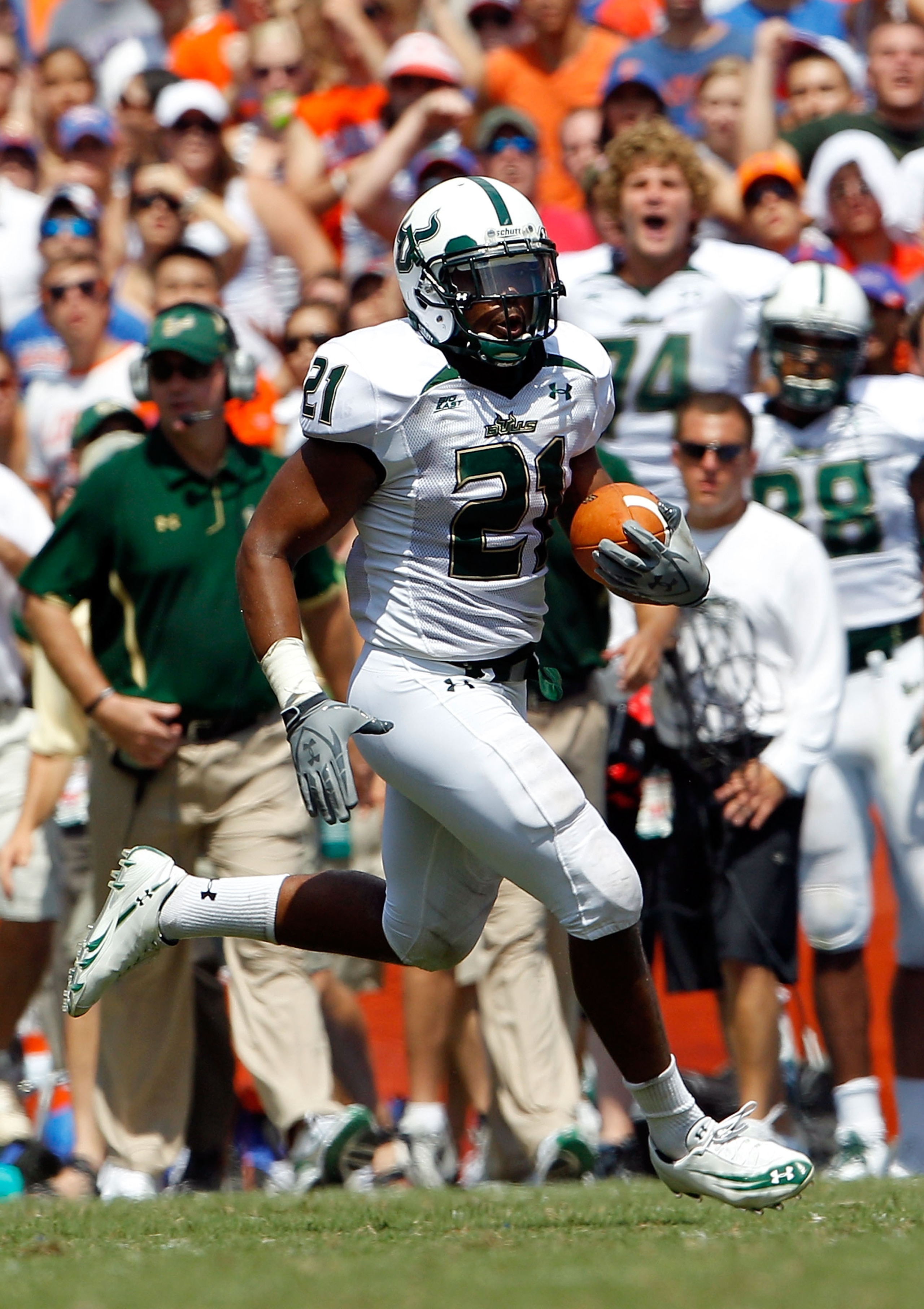 GAINESVILLE, FL - SEPTEMBER 11:  Demetris Murray #21 of the South Florida Bulls runs for yardage during a game against the Florida Gators at Ben Hill Griffin Stadium on September 11, 2010 in Gainesville, Florida.  (Photo by Sam Greenwood/Getty Images)