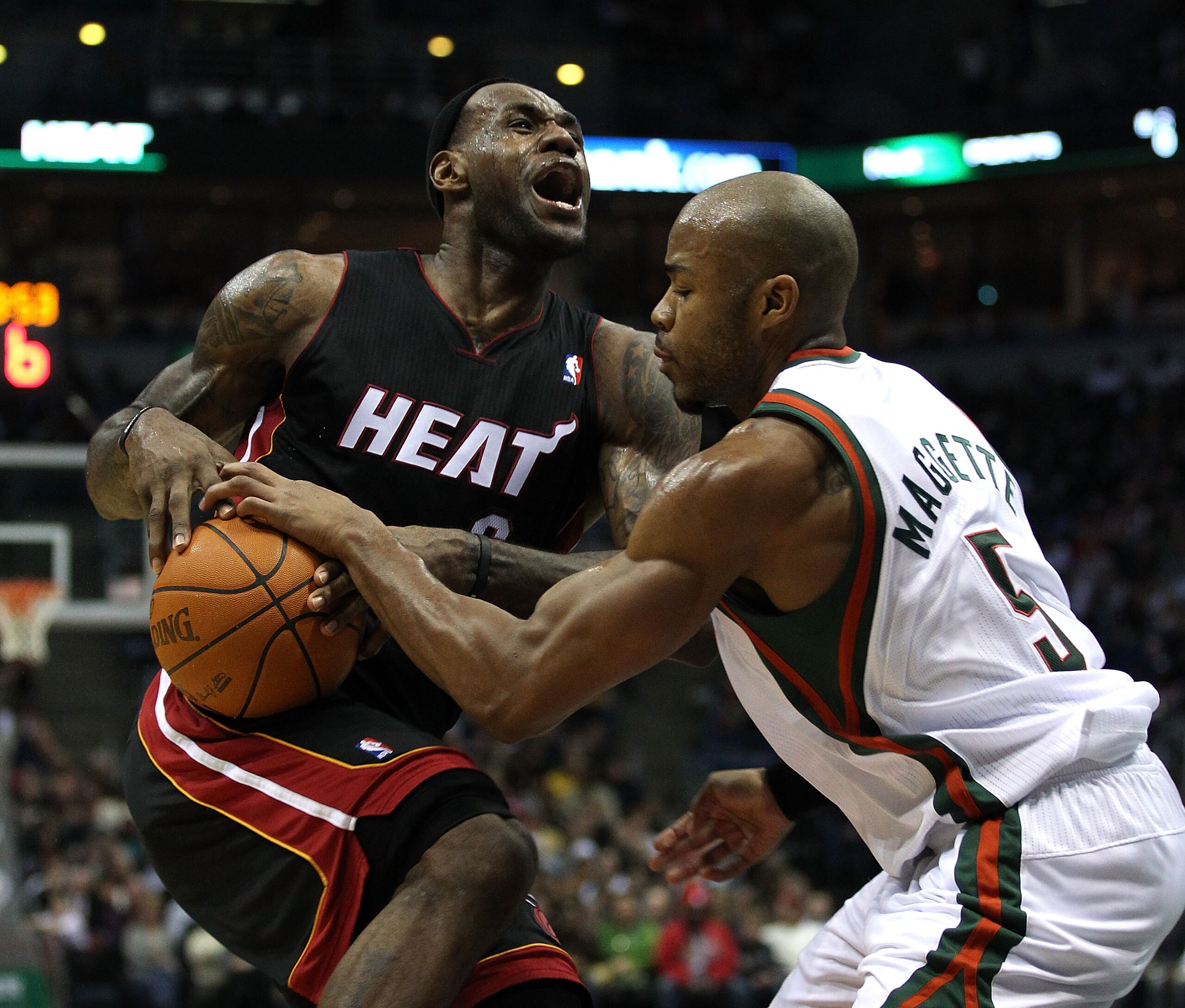 MILWAUKEE, WI - DECEMBER 06: LeBron James #6 of the Miami Heat is fouled by Corey Maggette #5 of the Milwaukee Bucks at the Bradley Center on December 6, 2010 in Milwaukee, Wisconsin. The Heat defeated the Bucks 88-78. NOTE TO USER: User expressly acknowl