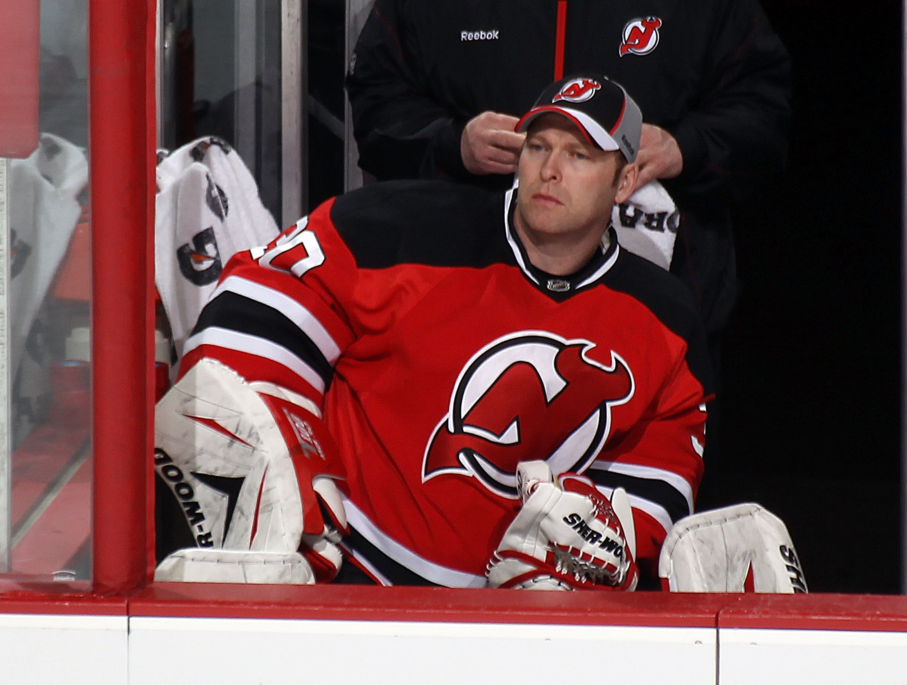 NEWARK, NJ - JANUARY 06: Martin Brodeur #30 of the New Jersey Devils watches the game from the bench against the Philadelphia Flyers at the Prudential Center on January 6, 2011 in Newark, New Jersey.  (Photo by Bruce Bennett/Getty Images)
