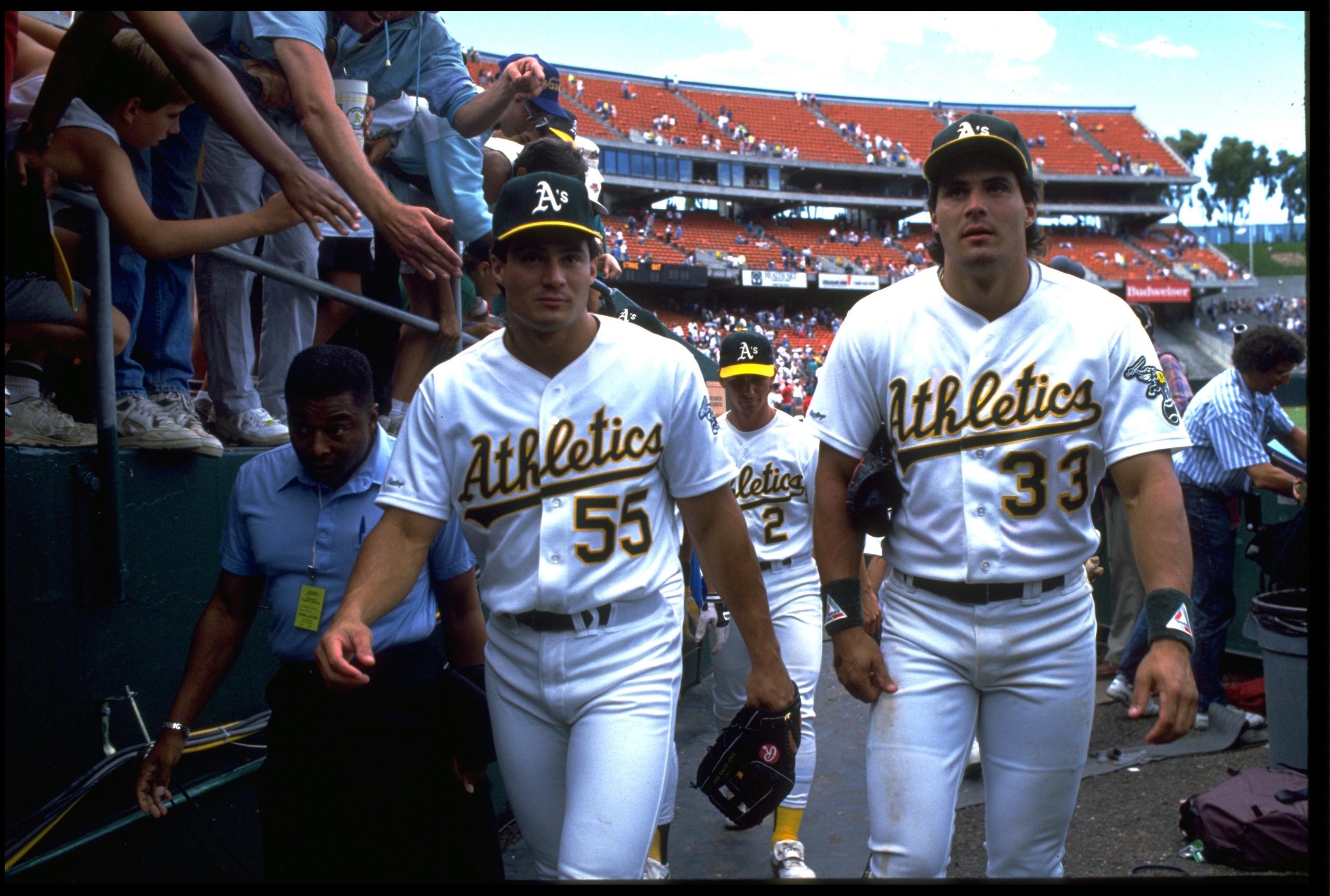 1990:  THE CANSECO TWINS, OZZIE, LEFT, AND JOSE, WALK OFF THE FIELD AFTER THE OAKLAND A''S 1990 GAME SEASON AT THE OAKLAND COLISEUM IN OAKLAND, CALIFORNIA.  MANDATORY CREDIT: OTTO GREULE/ALLSPORT.