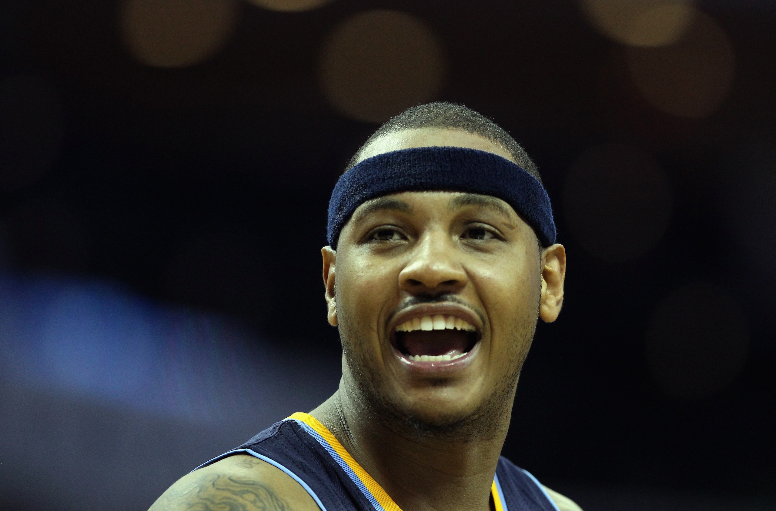 CHARLOTTE, NC - DECEMBER 07: Carmelo Anthony #15 of the Denver Nuggets reacts to a call against the Charlotte Bobcats during their game at Time Warner Cable Arena on December 7, 2010 in Charlotte, North Carolina. NOTE TO USER: User expressly acknowledge CHARLOTTE, NC - DECEMBER 07: Carmelo Anthony #15 of the Denver Nuggets reacts to a call against the Charlotte Bobcats during their game at Time Warner Cable Arena on December 7, 2010 in Charlotte, North Carolina. NOTE TO USER: User expressly acknowledge