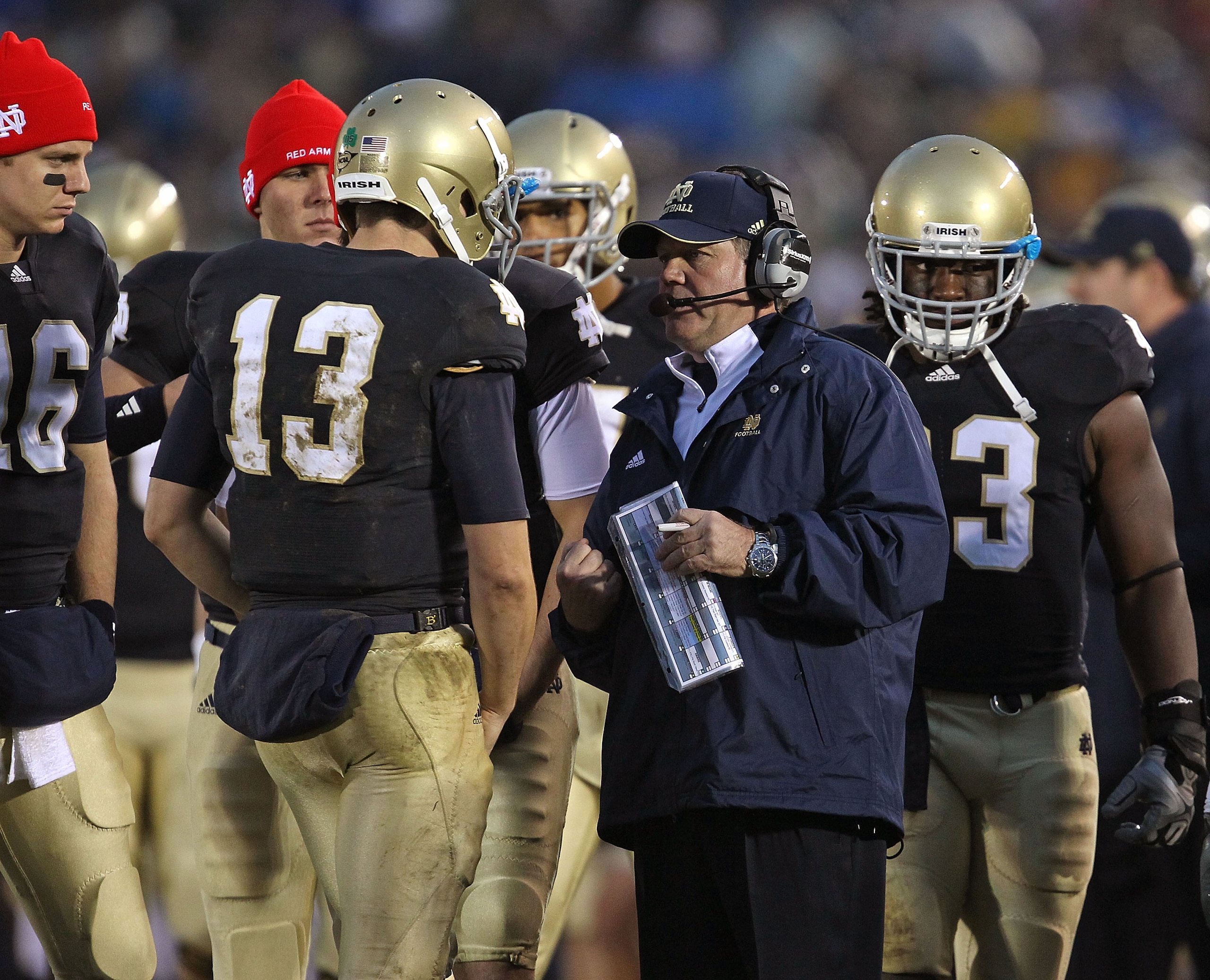 SOUTH BEND, IN - NOVEMBER 13: Head coach Brian Kelly of the Notre Dame Fighting Irish talks with Tommy Rees #13 during a game against the Utah Utes at Notre Dame Stadium on November 13, 2010 in South Bend, Indiana. Notre Dame defeated Utah 28-3. (Photo by