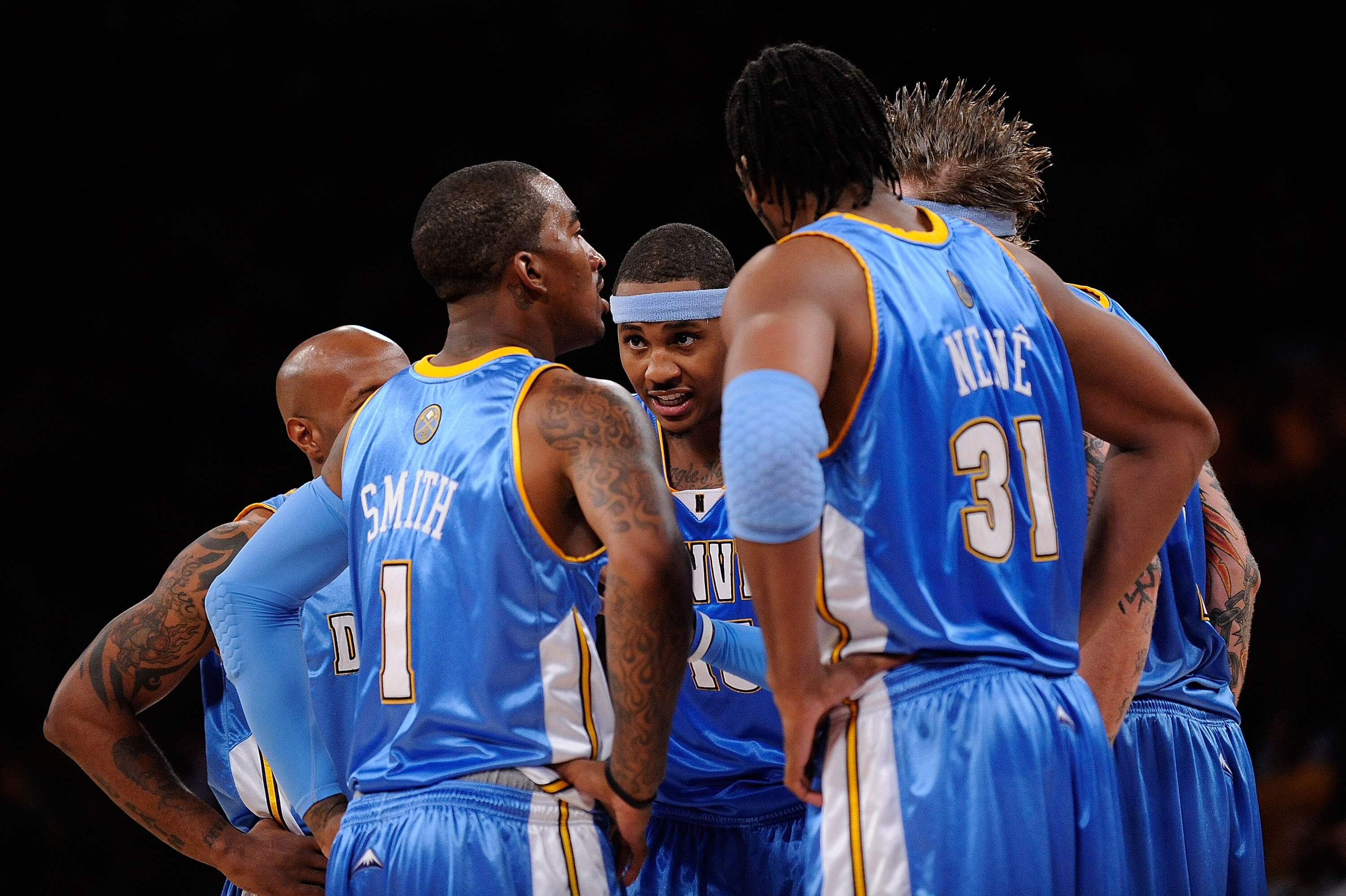LOS ANGELES, CA - MAY 19:  (M) Carmelo Anthony #15 of the Denver Nuggets talks with his teammates in the second half against the Los Angeles Lakers in Game One of the Western Conference Finals during the 2009 NBA Playoffs at Staples Center on May 19, 2009