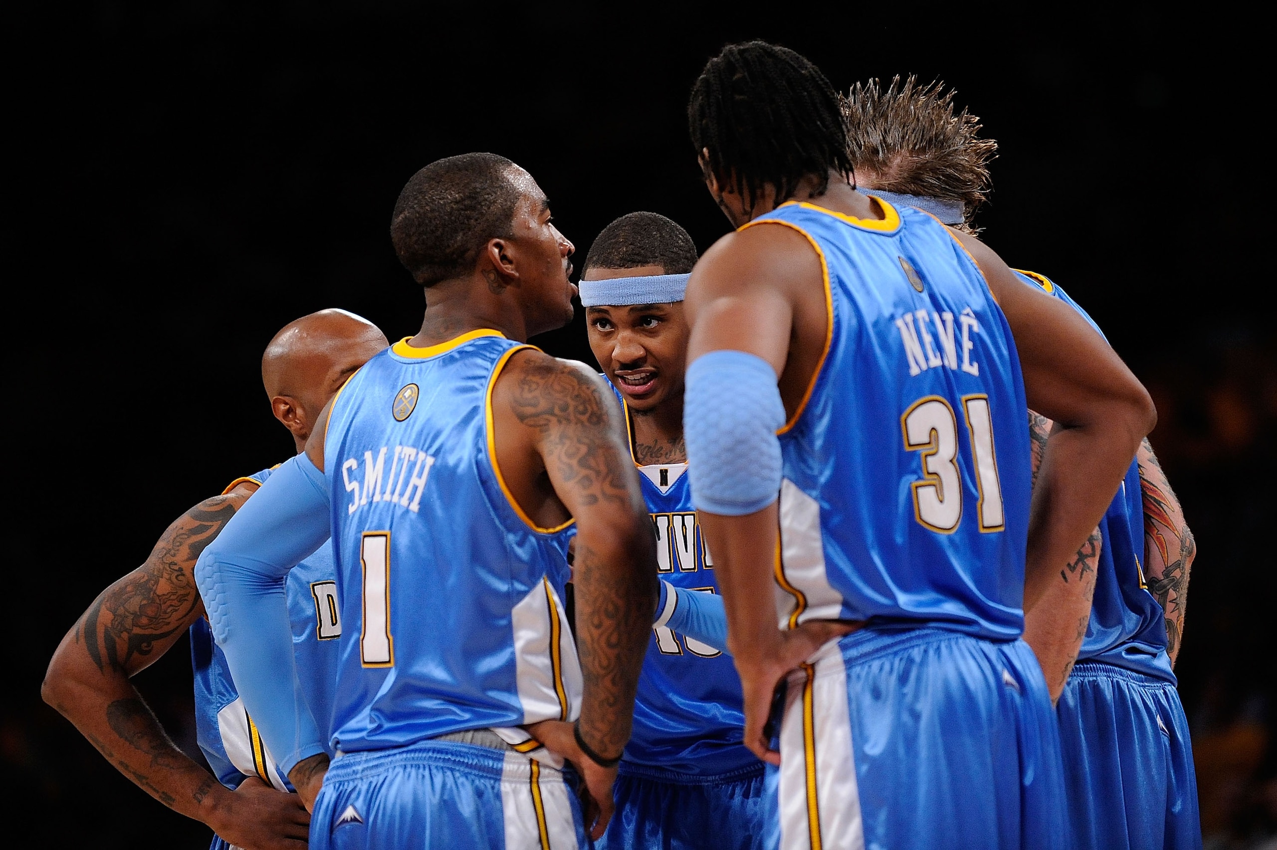 LOS ANGELES, CA - MAY 19:  (M) Carmelo Anthony #15 of the Denver Nuggets talks with his teammates in the second half against the Los Angeles Lakers in Game One of the Western Conference Finals during the 2009 NBA Playoffs at Staples Center on May 19, 2009