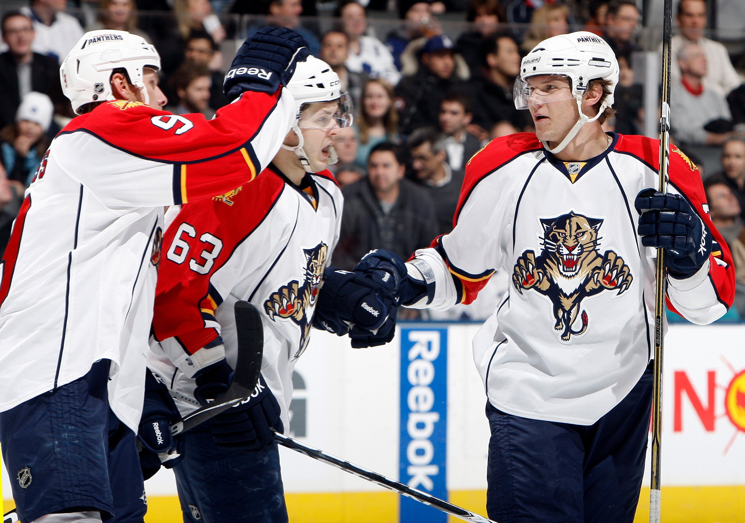 TORONTO, CANADA - FEBRUARY 1:  Stephen Weiss #9, Evgeni Dadonov #63 and  Dmitry Kulikov #7 of the Florida Panthers celebrate goal against the Toronto Maple Leafs during game action at the Air Canada Centre February 1, 2011 in Toronto, Ontario, Canada. (Ph