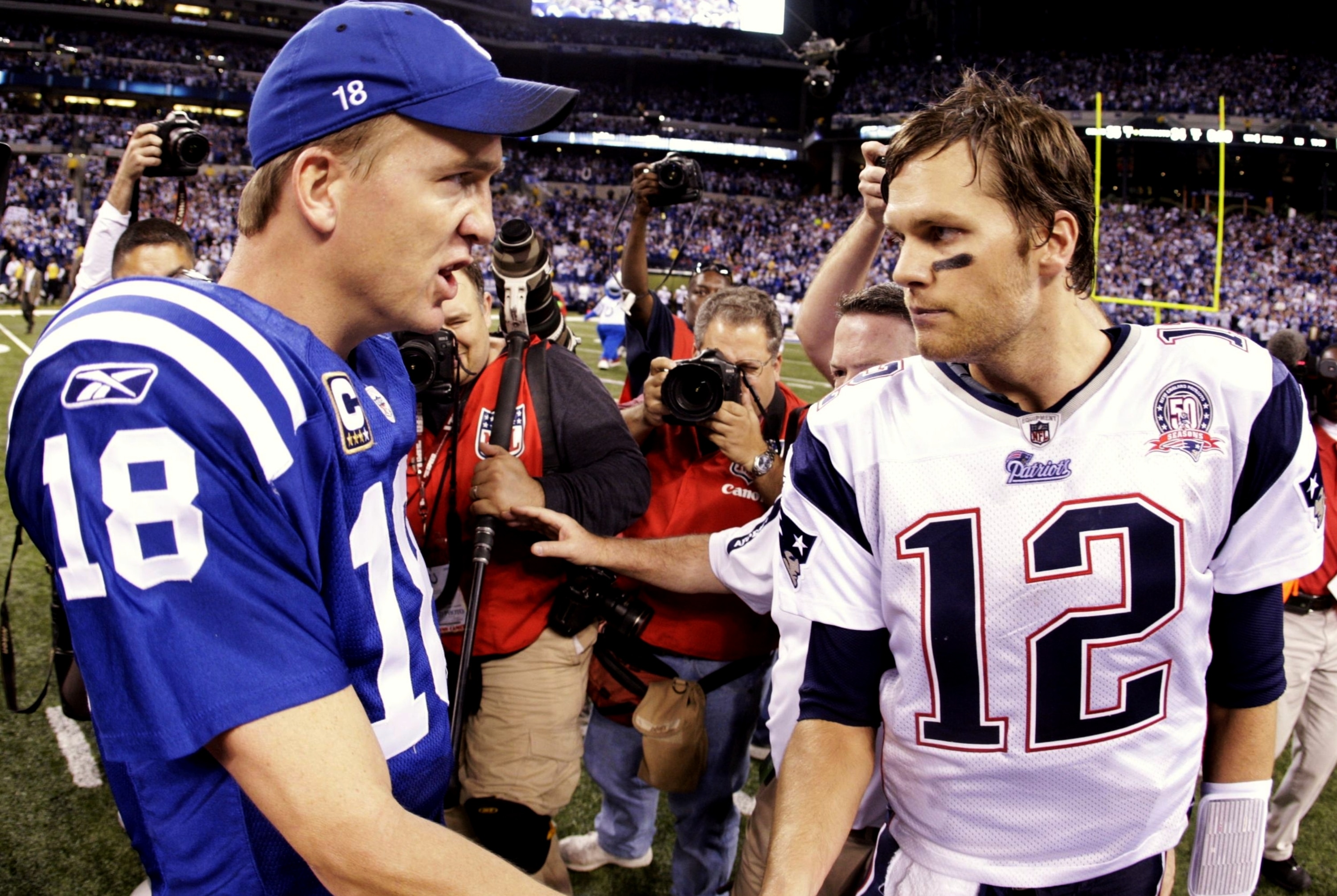 INDIANAPOLIS - NOVEMBER 15: Quarterback Peyton Manning #18 of the Indianapolis Colts greets Tom Brady #12 of the New England Patriots after the game at Lucas Oil Stadium on November 15, 2009 in Indianapolis, Indiana. The Colts won the game 35-34. (Phot INDIANAPOLIS - NOVEMBER 15: Quarterback Peyton Manning #18 of the Indianapolis Colts greets Tom Brady #12 of the New England Patriots after the game at Lucas Oil Stadium on November 15, 2009 in Indianapolis, Indiana. The Colts won the game 35-34. (Phot