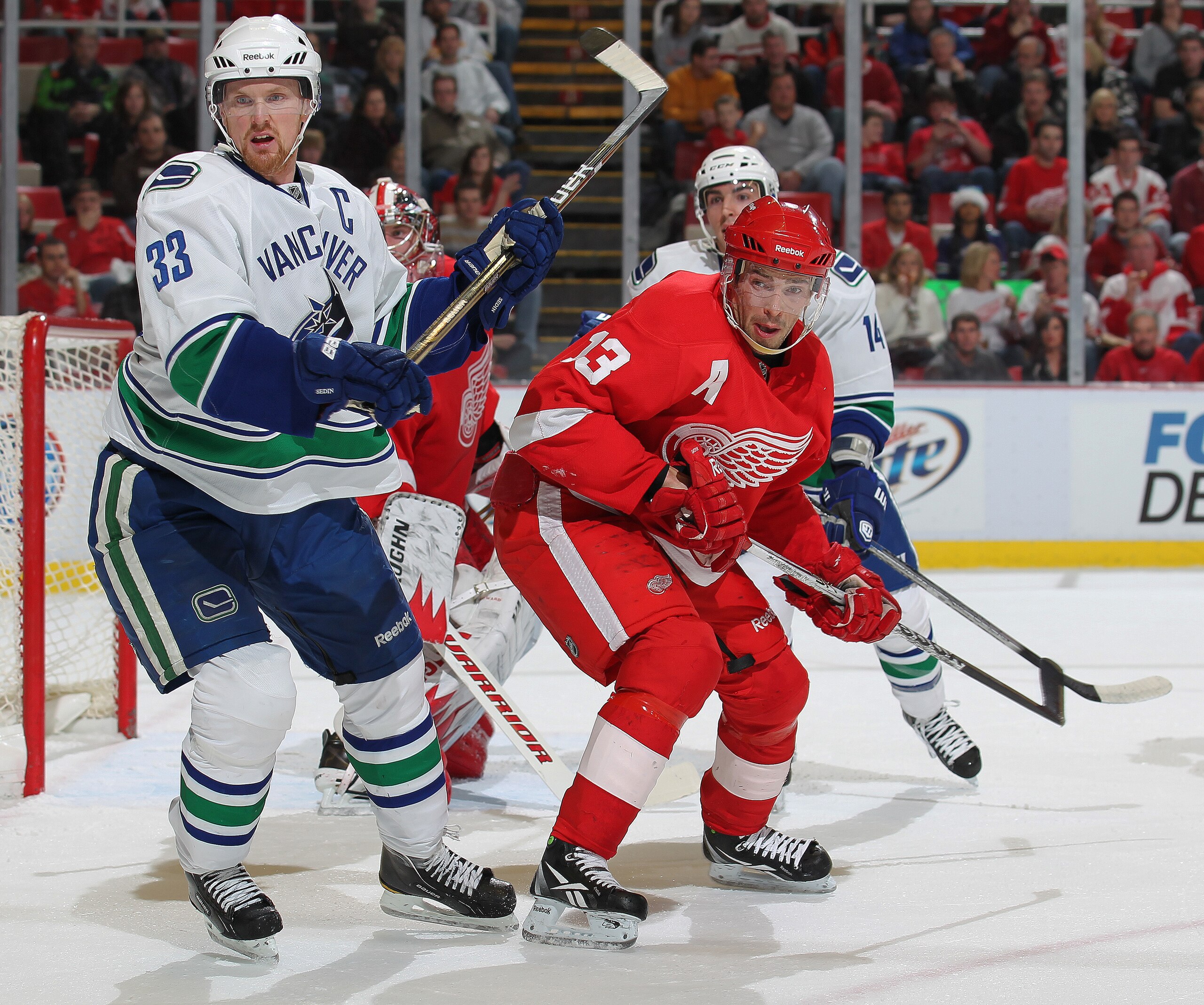 DETROIT, MI - DECEMBER 22:  Henrik Sedin #33 of the Vancouver Canucks skates against Pavel Datsyuk #13 of the Detroit Red Wings in a game on December 22, 2010 at the Joe Louis Arena in Detroit, Michigan. (Photo by Claus Andersen/Getty Images)