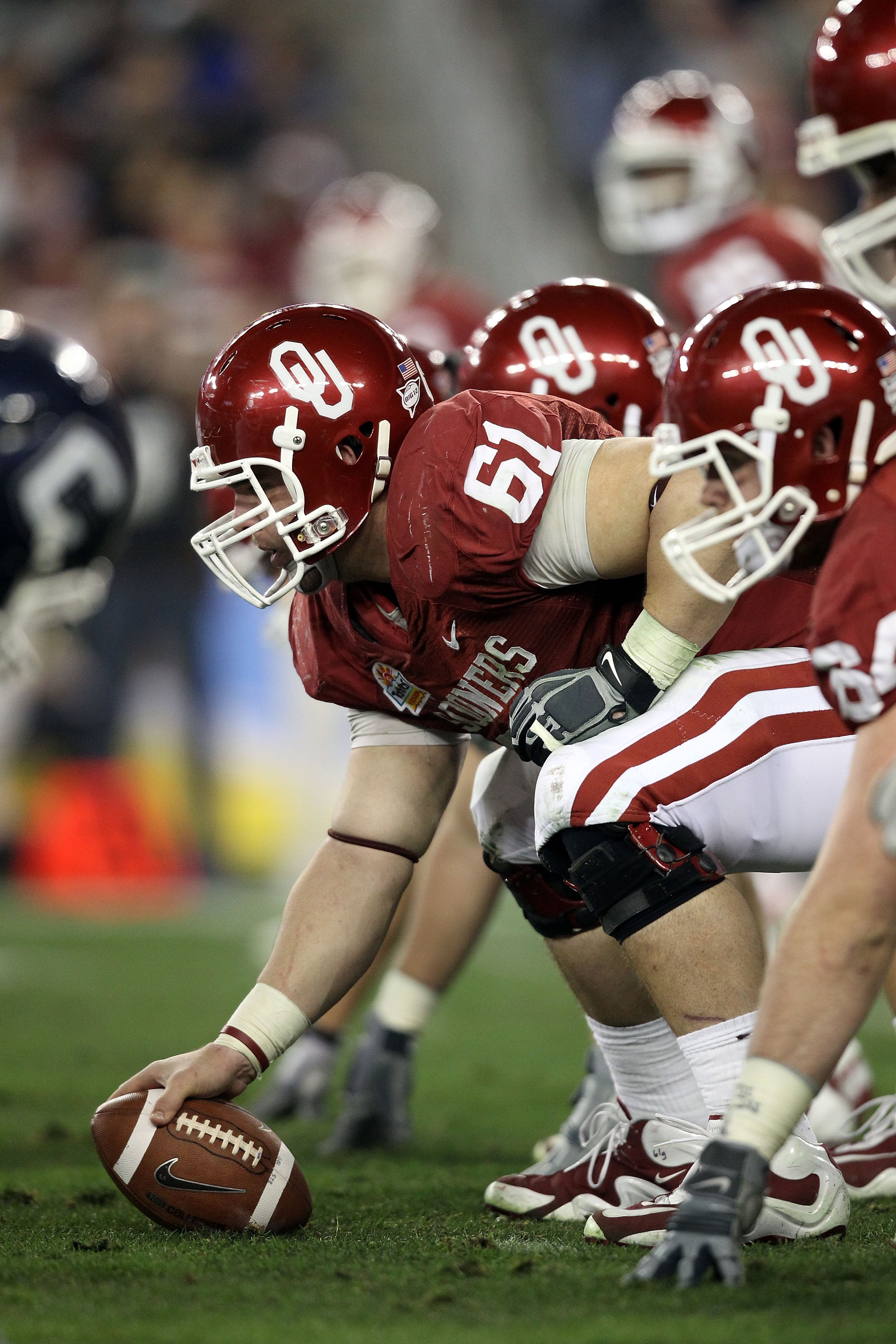 GLENDALE, AZ - JANUARY 01: Ben Habern #61 of the Oklahoma Sooners prepares to snap the football against the Connecticut Huskies during the Tostitos Fiesta Bowl at the Universtity of Phoenix Stadium on January 1, 2011 in Glendale, Arizona. (Photo by Chri