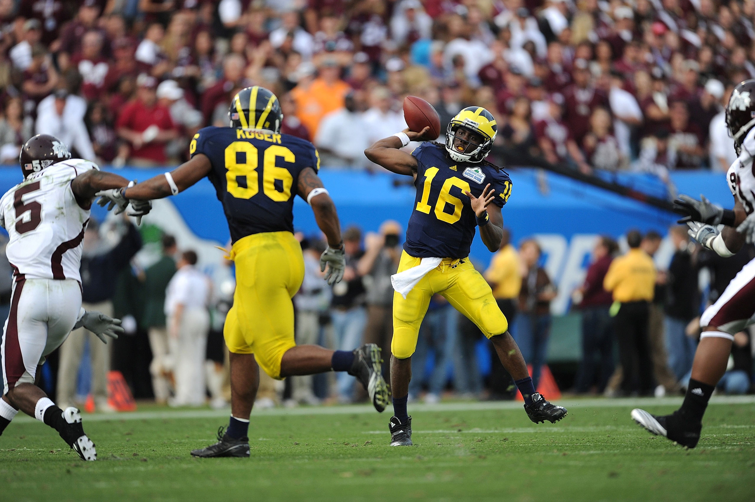 JACKSONVILLE, FL - JANUARY 01:  Quarterback Denard Robinson #16 of the Michigan Wolverines passes against the Mississippi State Bulldogs during the Gator Bowl at EverBank Field on January 1, 2011 in Jacksonville, Florida  (Photo by Rick Dole/Getty Images)