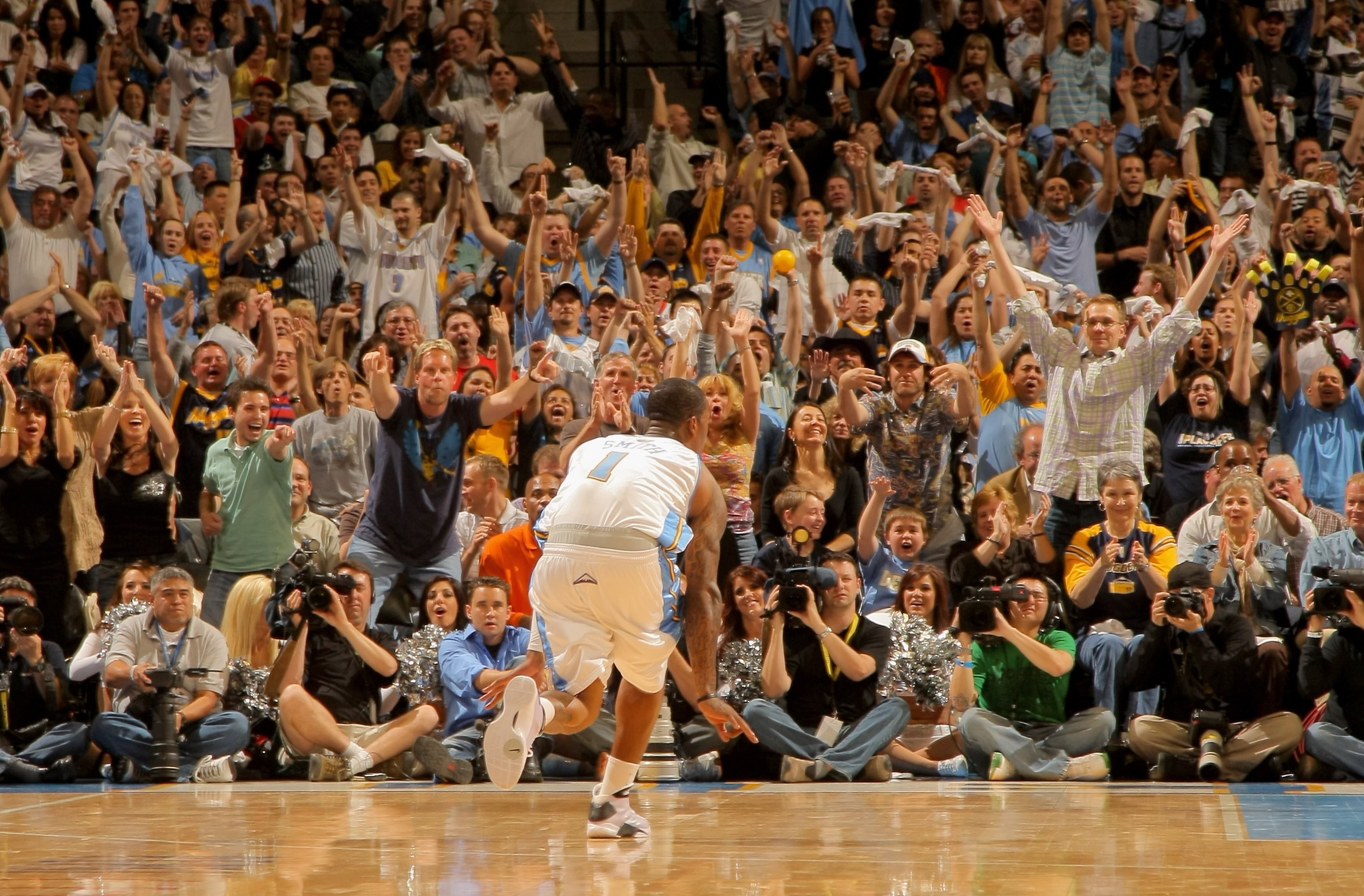 DENVER - APRIL 29:  J.R. Smith #1 of the Denver Nuggets celebrates a three point goal against the New Orleans Hornets to the delight of the crowd in Game Five of the Western Conference Quarterfinals during the 2009 NBA Playoffs at Pepsi Center on April 29