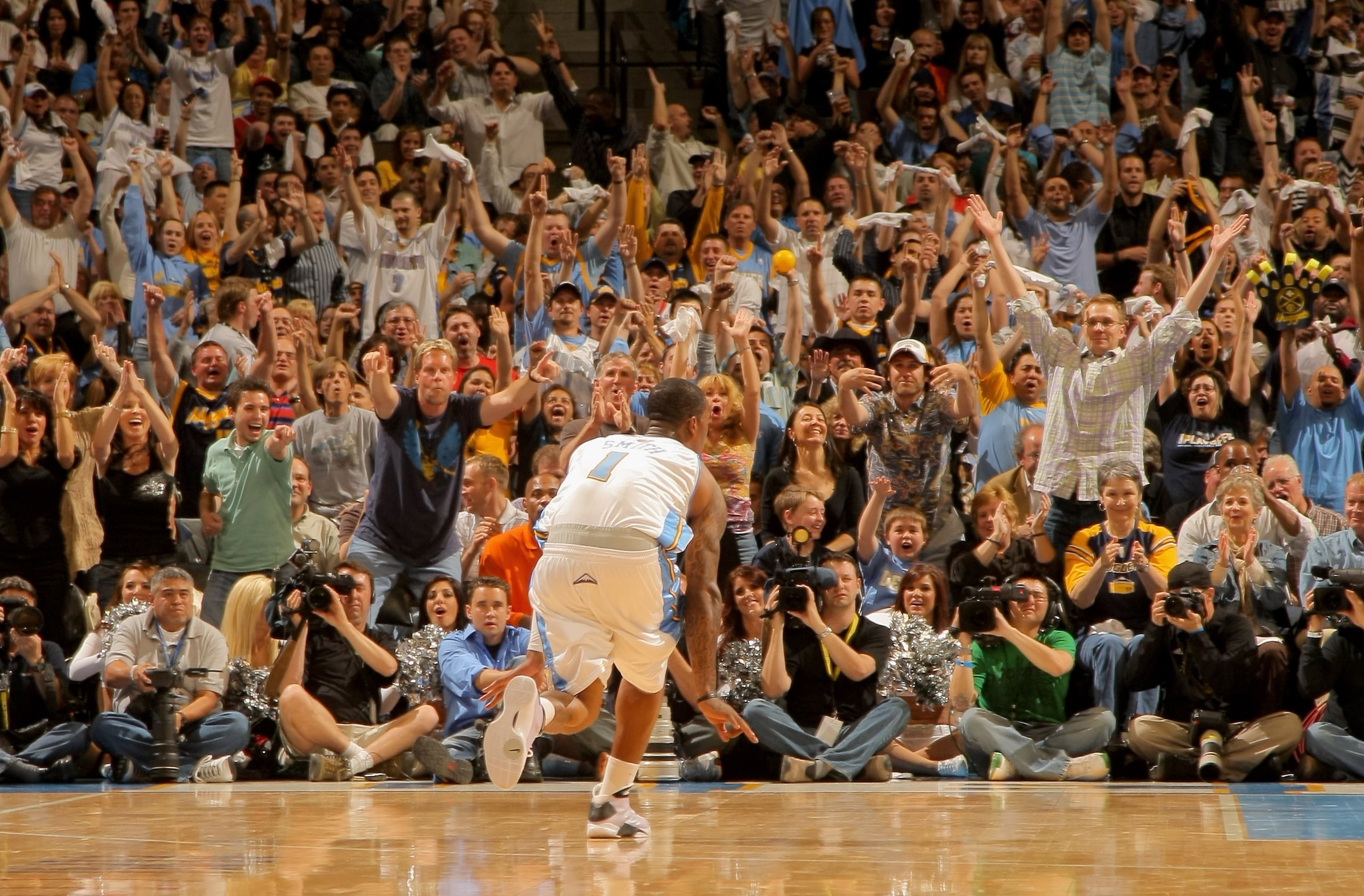 DENVER - APRIL 29:  J.R. Smith #1 of the Denver Nuggets celebrates a three point goal against the New Orleans Hornets to the delight of the crowd in Game Five of the Western Conference Quarterfinals during the 2009 NBA Playoffs at Pepsi Center on April 29