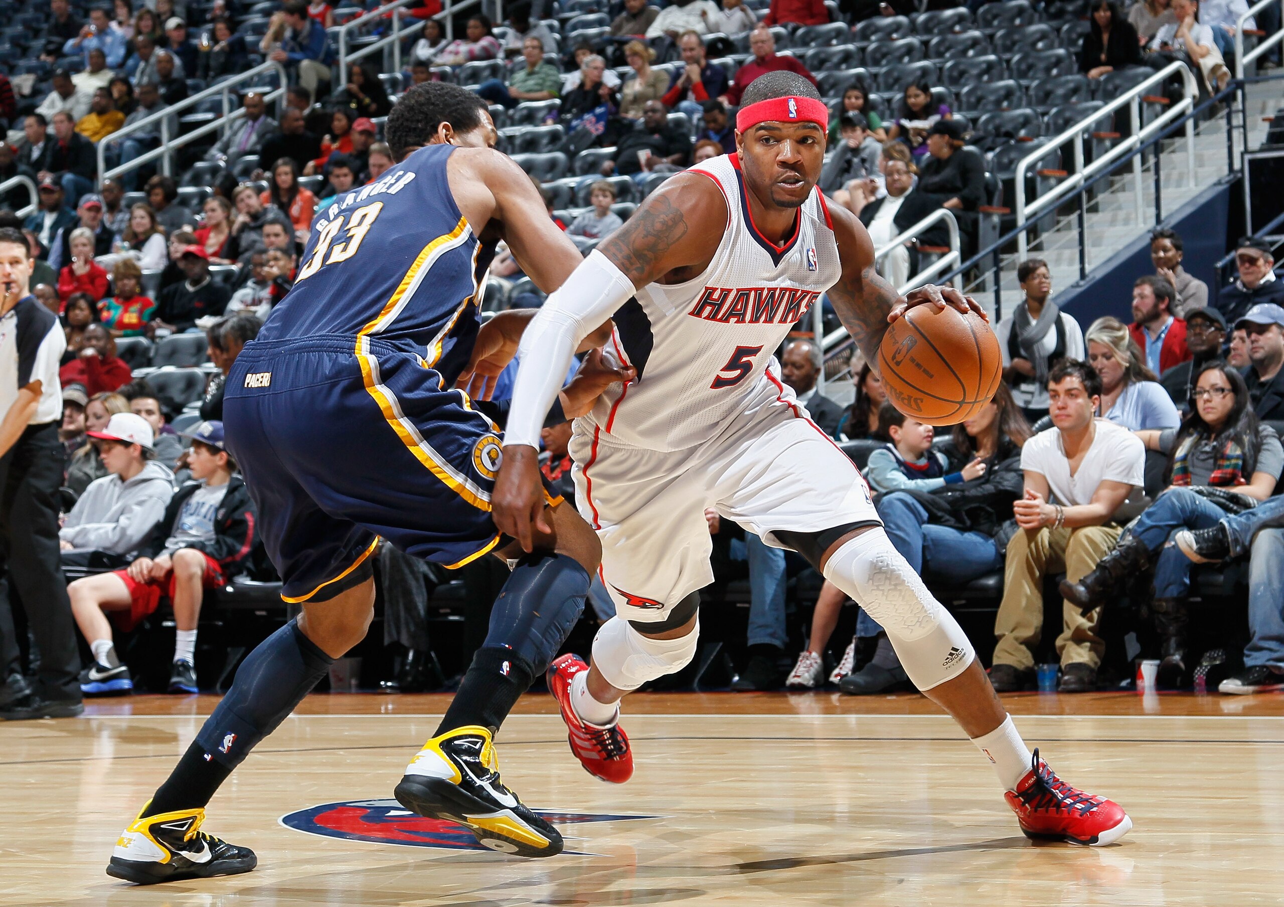 ATLANTA, GA - DECEMBER 11: Josh Smith #5 of the Atlanta Hawks against Danny Granger #33 of the Indiana Pacers at Philips Arena on December 11, 2010 in Atlanta, Georgia. NOTE TO USER: User expressly acknowledges and agrees that, by downloading and/or usi ATLANTA, GA - DECEMBER 11: Josh Smith #5 of the Atlanta Hawks against Danny Granger #33 of the Indiana Pacers at Philips Arena on December 11, 2010 in Atlanta, Georgia. NOTE TO USER: User expressly acknowledges and agrees that, by downloading and/or usi