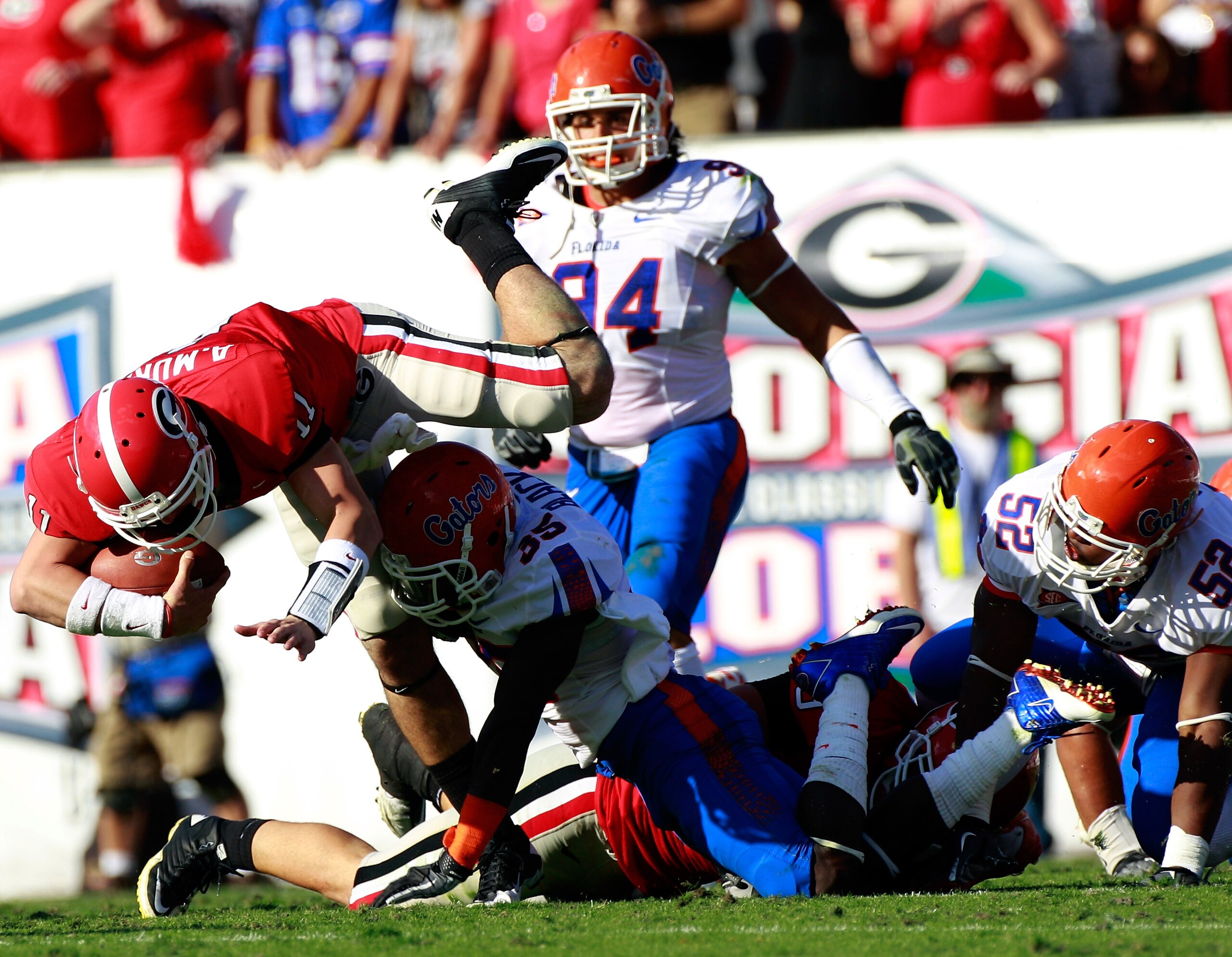 JACKSONVILLE, FL - OCTOBER 30:  Ahmad Black #35 of the Florida Gators tackles Aaron Murray #11 of the Georgia Bulldogs during the game at EverBank Field on October 30, 2010 in Jacksonville, Florida.  (Photo by Sam Greenwood/Getty Images)