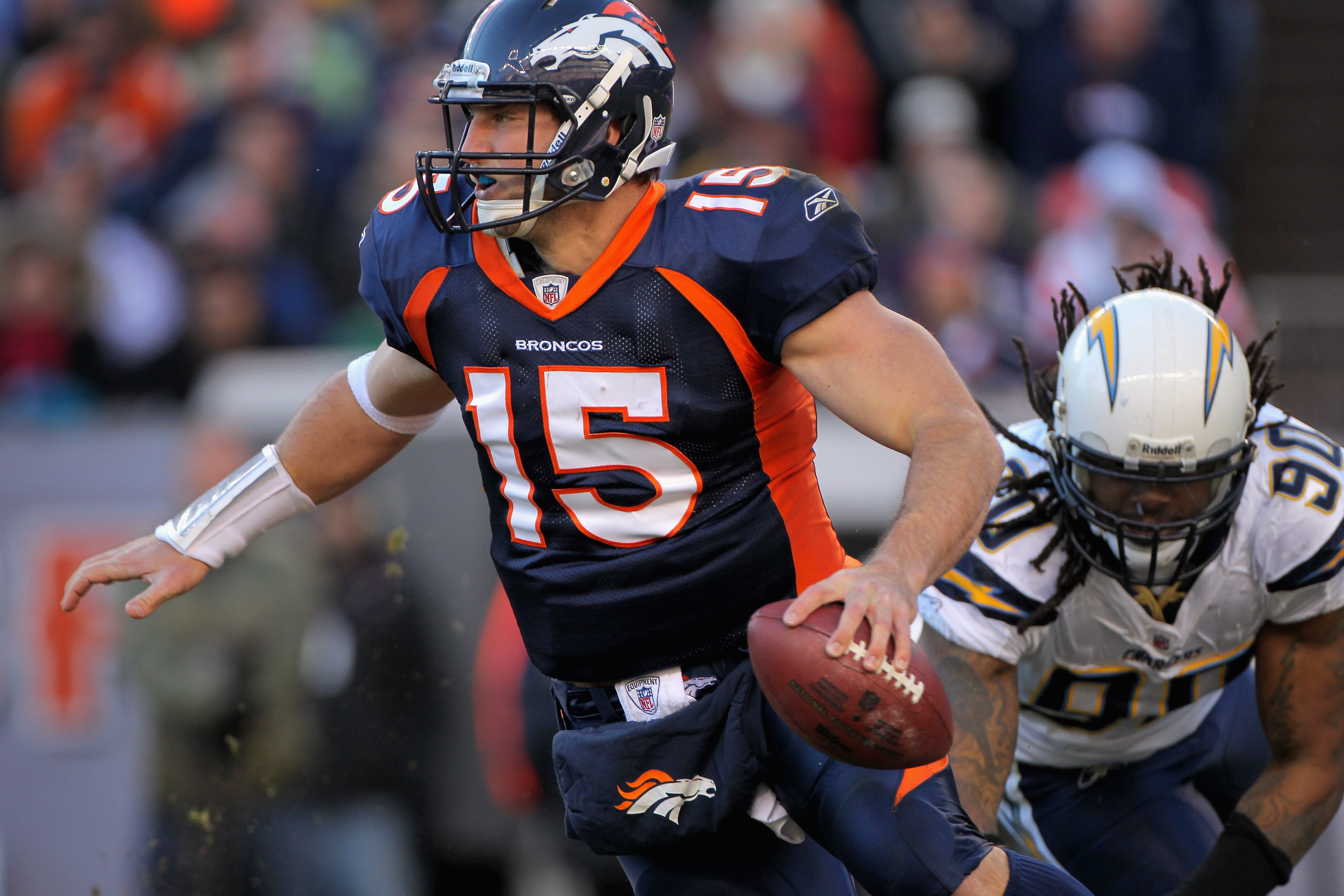 DENVER - JANUARY 02:  Quarterback Tim Tebow #15 of the Denver Broncos scrambles against the San Diego Chargers at INVESCO Field at Mile High on January 2, 2011 in Denver, Colorado.  (Photo by Doug Pensinger/Getty Images)