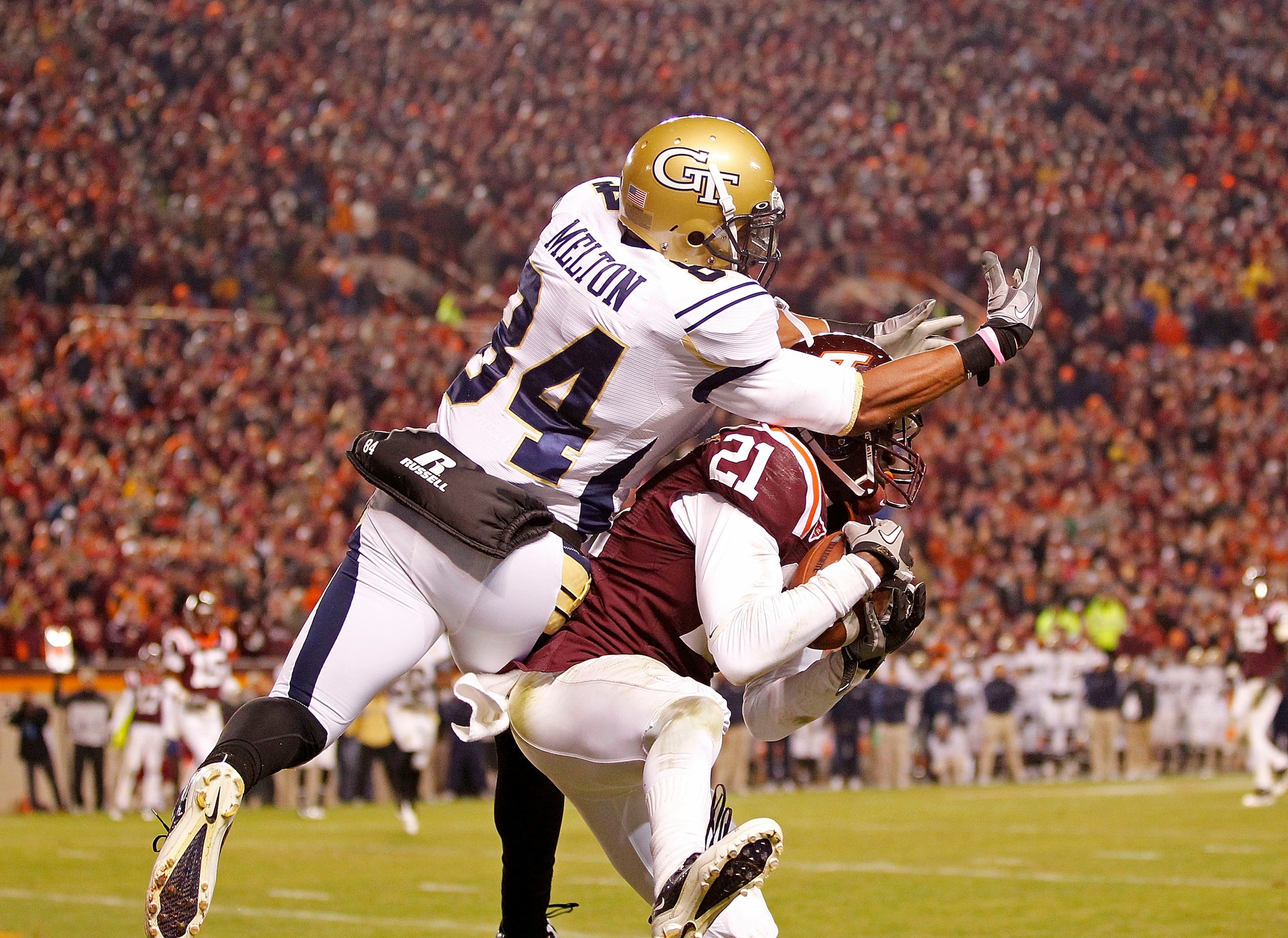 BLACKSBURG, VA - NOVEMBER 04:  Cornerback Rashad Carmichael #21 of the Virginia Tech Hokies intercepts a pass in the end zone in the final seconds intended for wide receiver Tyler Melton #84 of the Georgia Tech Yellow Jackets at Lane Stadium on November 4