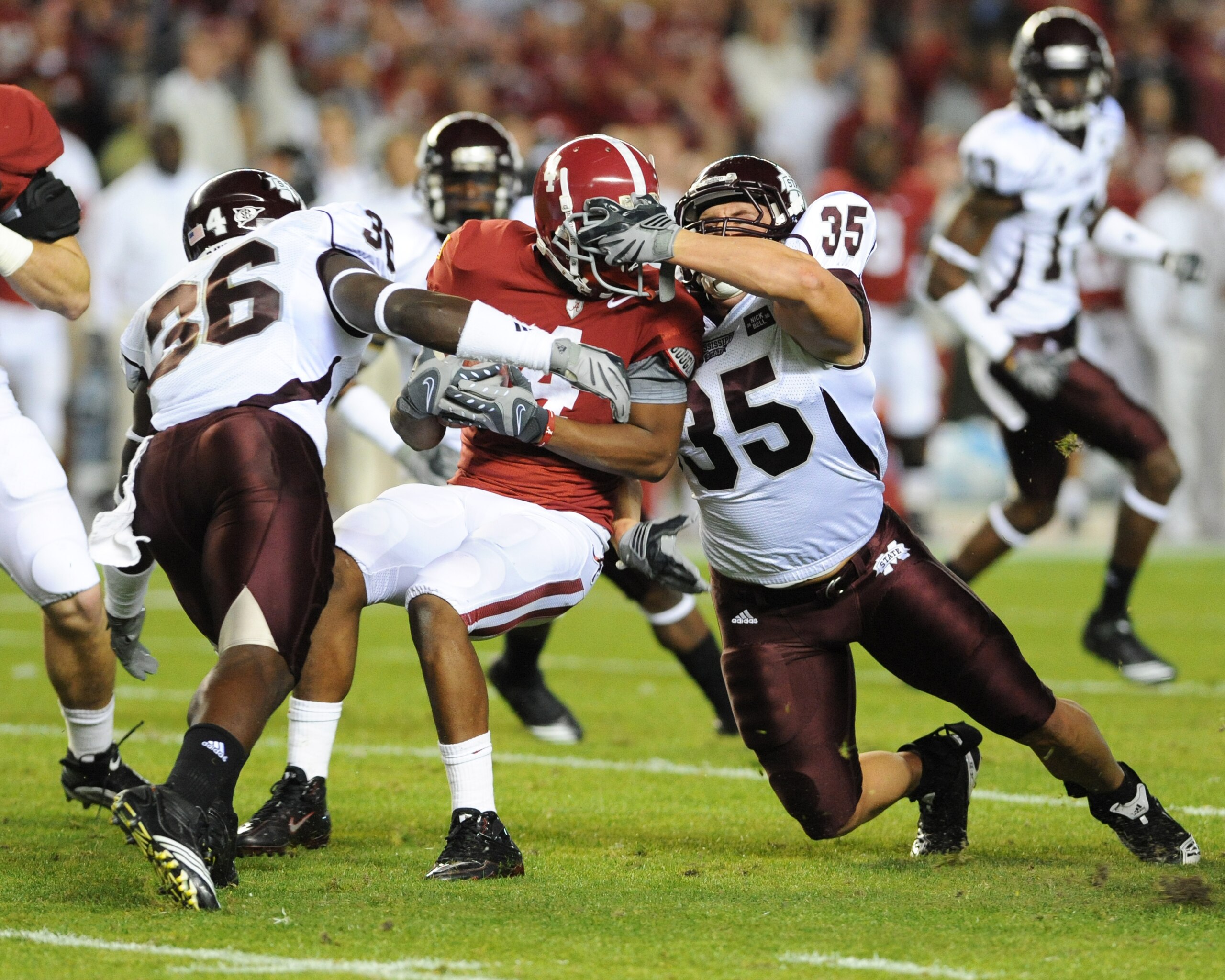 TUSCALOOSA, AL - NOVEMBER 13: Wide receiver Marquis Maze #4 of the Alabama Crimson Tide returns a kick and is tackled by Nick Bell #36 and Patrick Hanrahan #35 of the Mississippi State Bulldogs November 13, 2010 at Bryant-Denny Stadium in Tuscaloosa, Ala TUSCALOOSA, AL - NOVEMBER 13: Wide receiver Marquis Maze #4 of the Alabama Crimson Tide returns a kick and is tackled by Nick Bell #36 and Patrick Hanrahan #35 of the Mississippi State Bulldogs November 13, 2010 at Bryant-Denny Stadium in Tuscaloosa, Ala