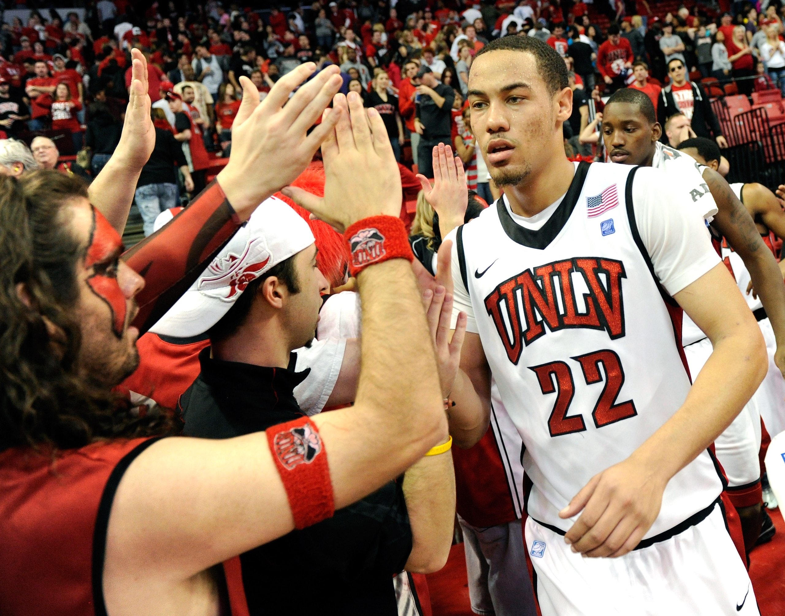 LAS VEGAS, NV - JANUARY 22:  Chace Stanback #22 of the UNLV Rebels celebrates with fans after the team's 63-62 victory over the New Mexico Lobos at the Thomas & Mack Center January 22, 2011 in Las Vegas, Nevada.  (Photo by Ethan Miller/Getty Images)