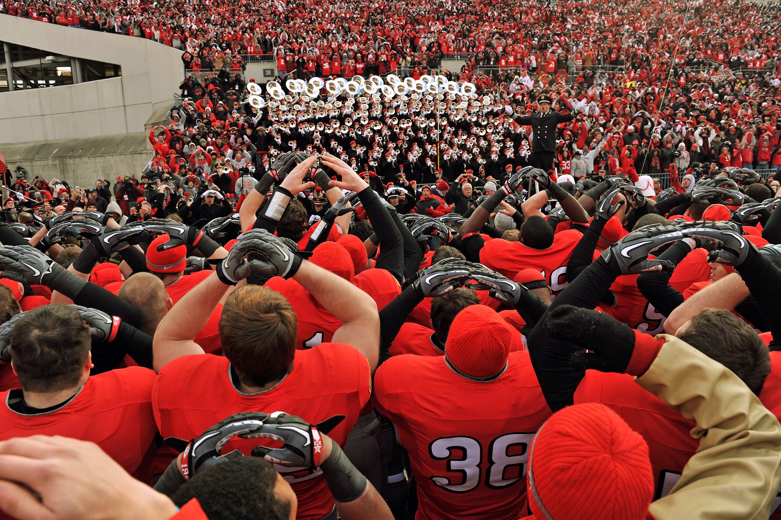 COLUMBUS, OH - NOVEMBER 27:  The Ohio State Buckeyes sing the school alma mater with the marching band after they defeated the Michigan Wolverines 37-7 at Ohio Stadium on November 27, 2010 in Columbus, Ohio.  (Photo by Jamie Sabau/Getty Images)
