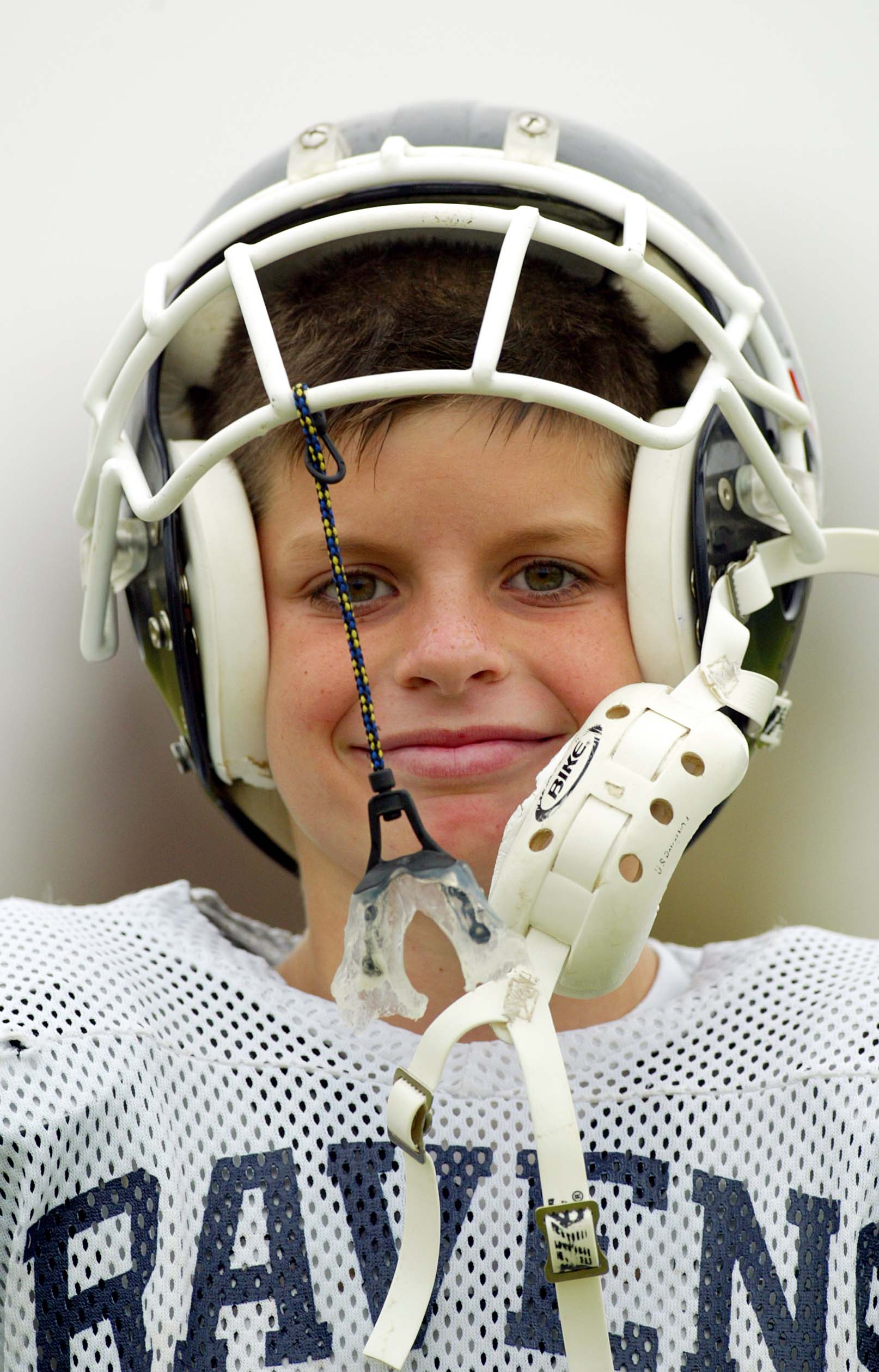 CARLSBAD, CA - NOVEMBER 9:  A player from the San Dieguito Ravens looks on during his team's game against the Carlsbad Charging Lancers in the Pop Warner Division Finals on November 9, 2002 at Carlsbad High School, in Carlsbad, California.  (Photo by Dona