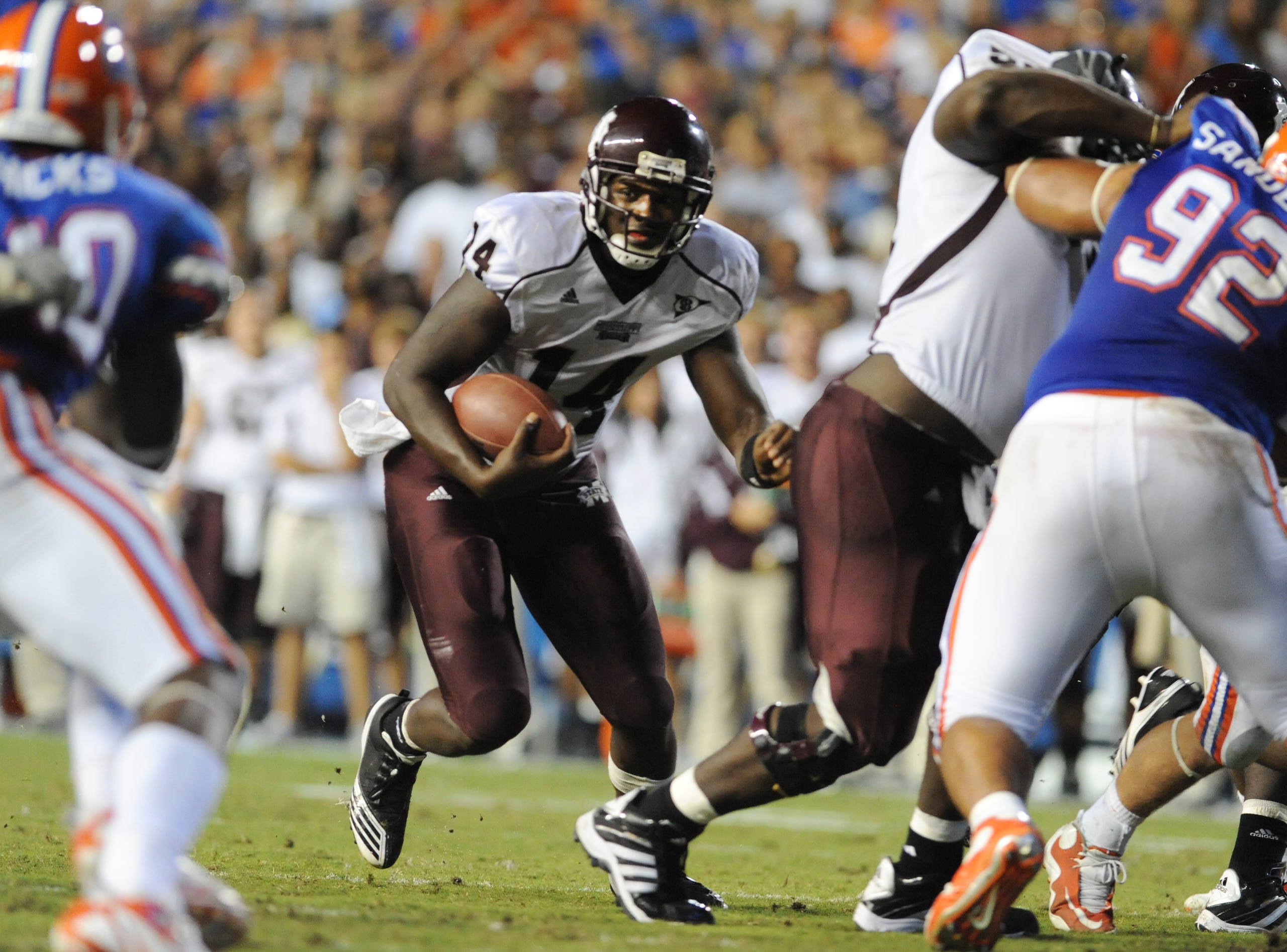 GAINESVILLE, FL - OCTOBER 16:  Quarterback Chris Relf #14 of the Mississippi State Bulldogs runs upfield against the Florida Gators  October 16, 2010 Ben Hill Griffin Stadium at Gainesville, Florida.  (Photo by Al Messerschmidt/Getty Images)