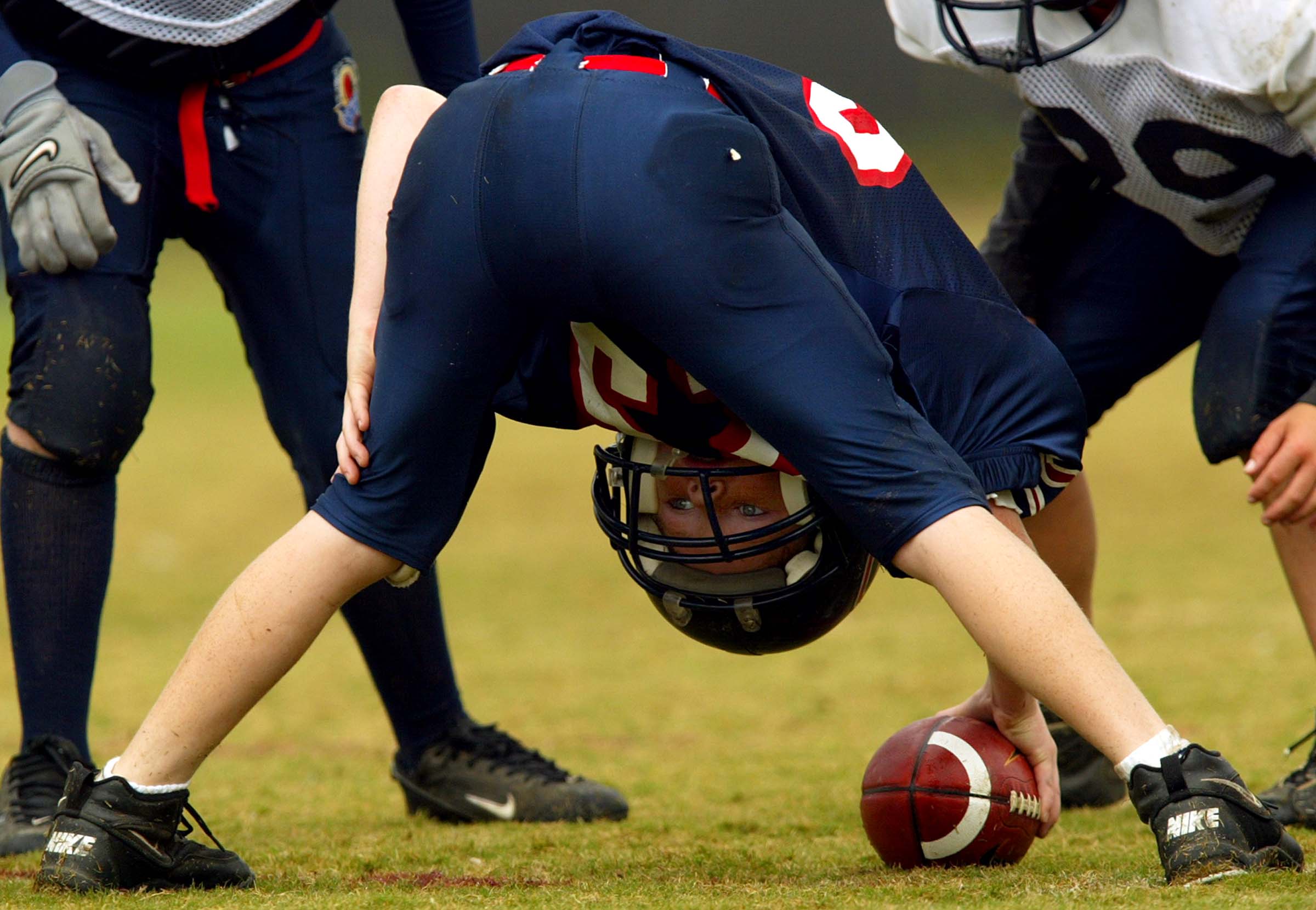 CARLSBAD, CA - NOVEMBER 9:  A center looks to hike the ball during the Pop Warner Championships on November 9, 2002 at Carlsbad High School, in Carlsbad, California.  (Photo by Donald Miralle/Getty Images)