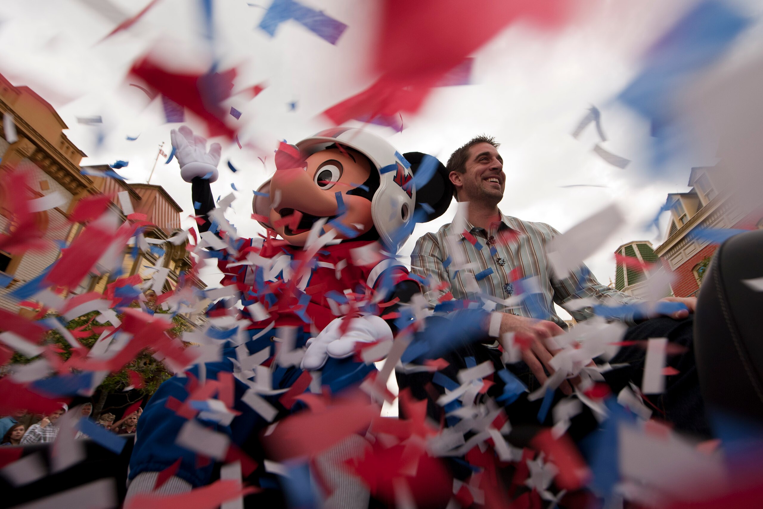 LAKE BUENA VISTA, FL - FEBRUARY 07:  In this handout photo provided by Disney, Super Bowl XLV Most Valuable Player Aaron Rodgers takes a celebratory ride with Mickey Mouse, following the Green Bay Packers' 31-25 victory over the Pittsburgh Steelers Februa