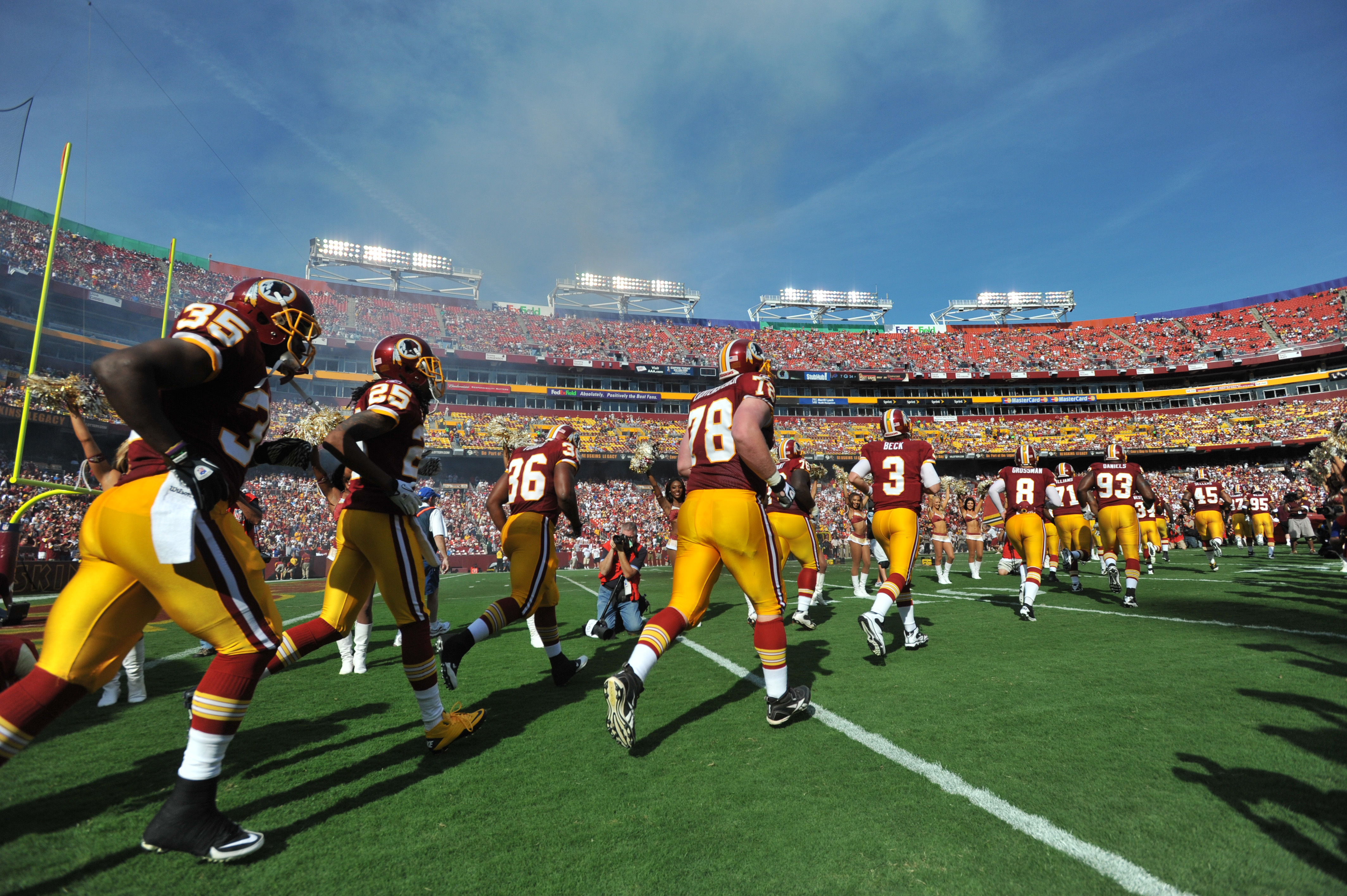 LANDOVER, MD - SEPTEMBER 19:  The Washington Redskins run onto the field before the game against the Houston Texans at FedExField on September 19, 2010 in Landover, Maryland. The Texans defeated the Redskins in overtime 30-27. (Photo by Larry French/Getty