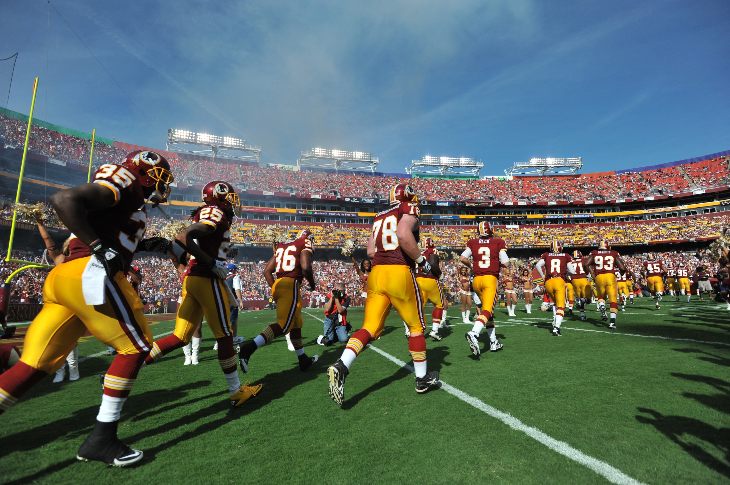 LANDOVER, MD - SEPTEMBER 19:  The Washington Redskins run onto the field before the game against the Houston Texans at FedExField on September 19, 2010 in Landover, Maryland. The Texans defeated the Redskins in overtime 30-27. (Photo by Larry French/Getty