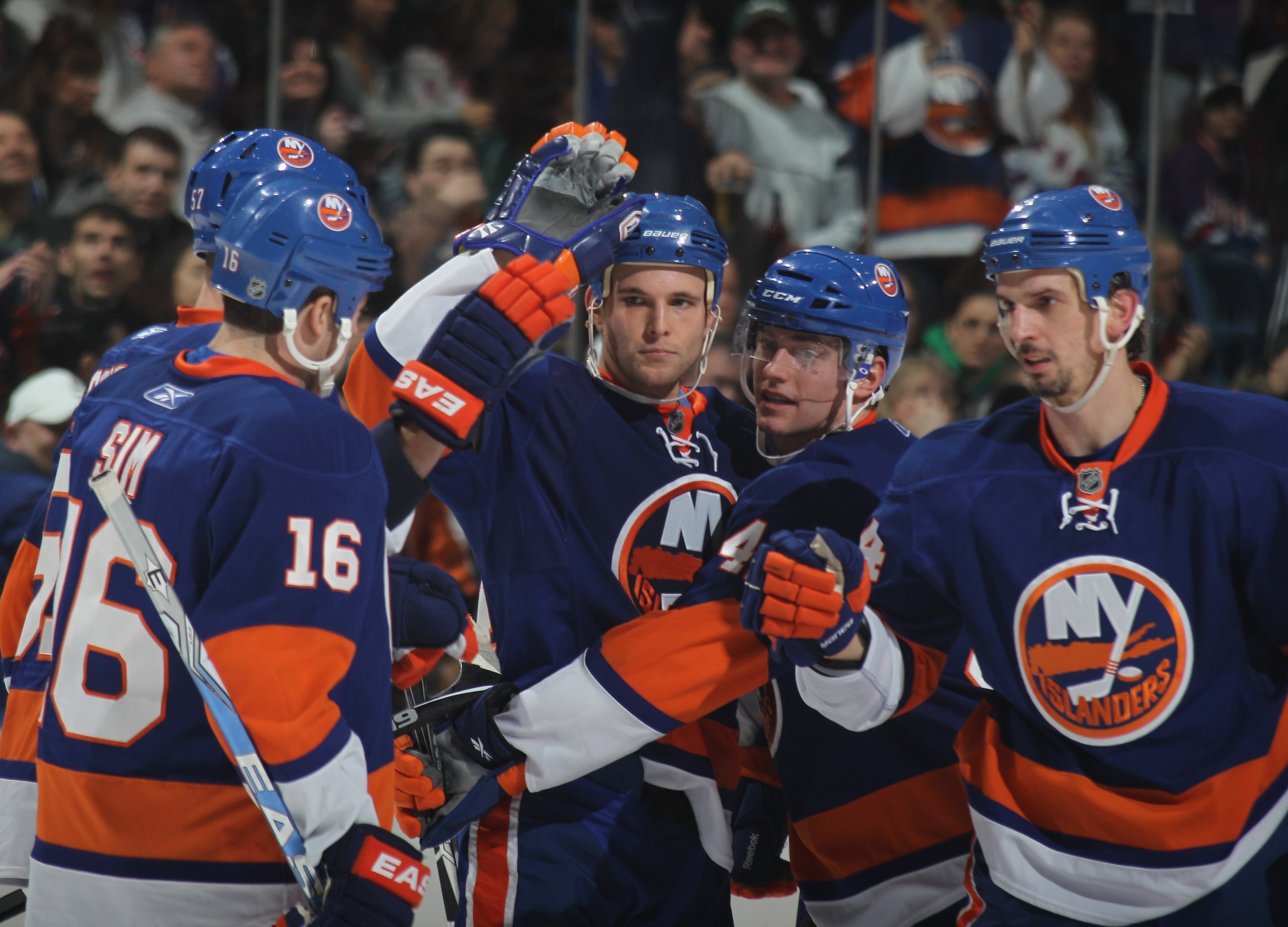 UNIONDALE, NY - DECEMBER 02: Rob Schremp #44 (C) of the New York Islanders celebrates his goal at 12:30 of the second period against the New York Rangers at the Nassau Coliseum on December 2, 2010 in Uniondale, New York.  (Photo by Bruce Bennett/Getty Ima