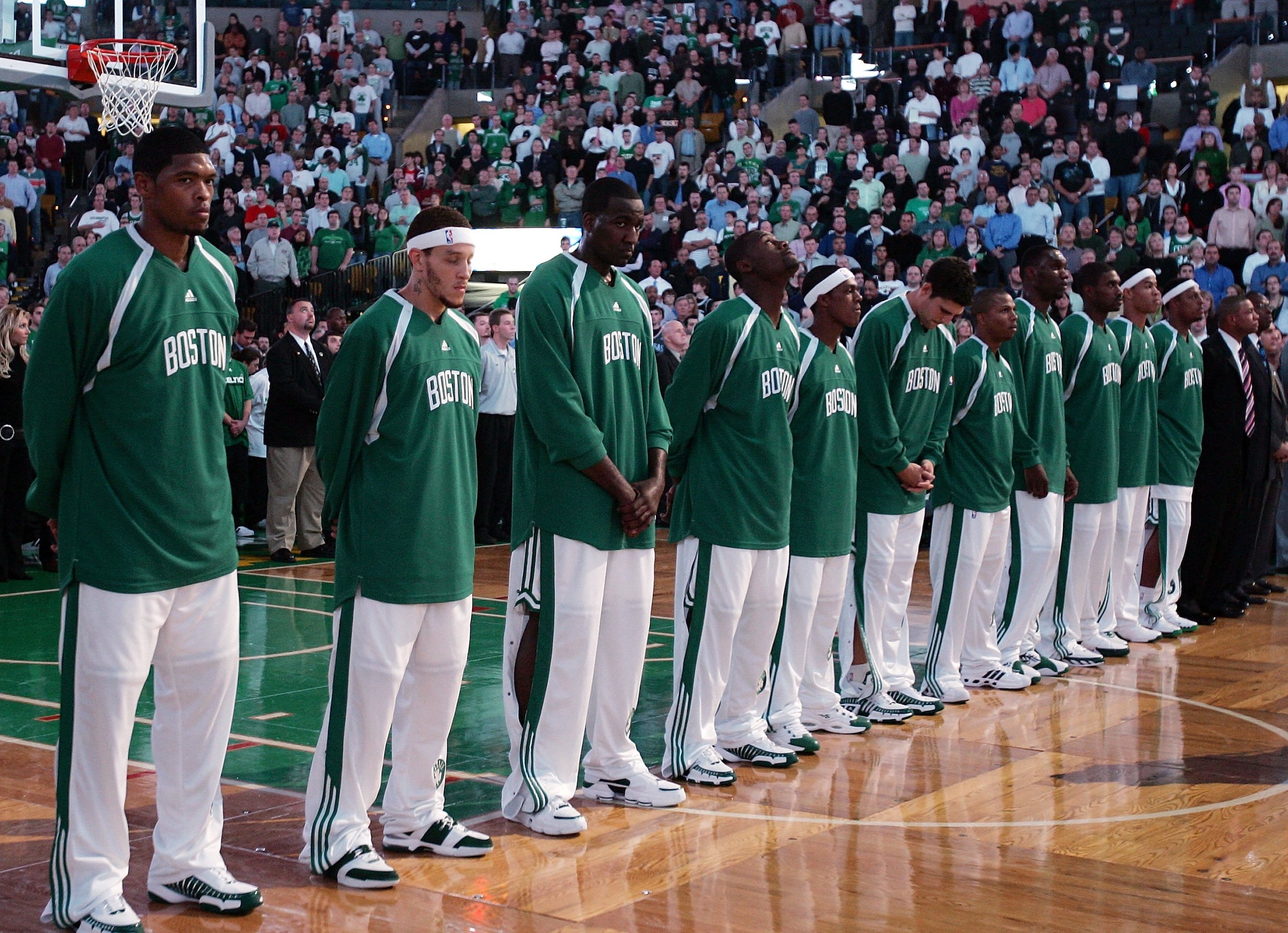 BOSTON - NOVEMBER 01:  The Boston Celtics take a moment of silence to honor the late President and former coach, Red Auerbach,before the home opener against the New Orleans/Oklahoma City Hornets on November 1, 2006 at TD Banknorth Garden in Boston, Massac