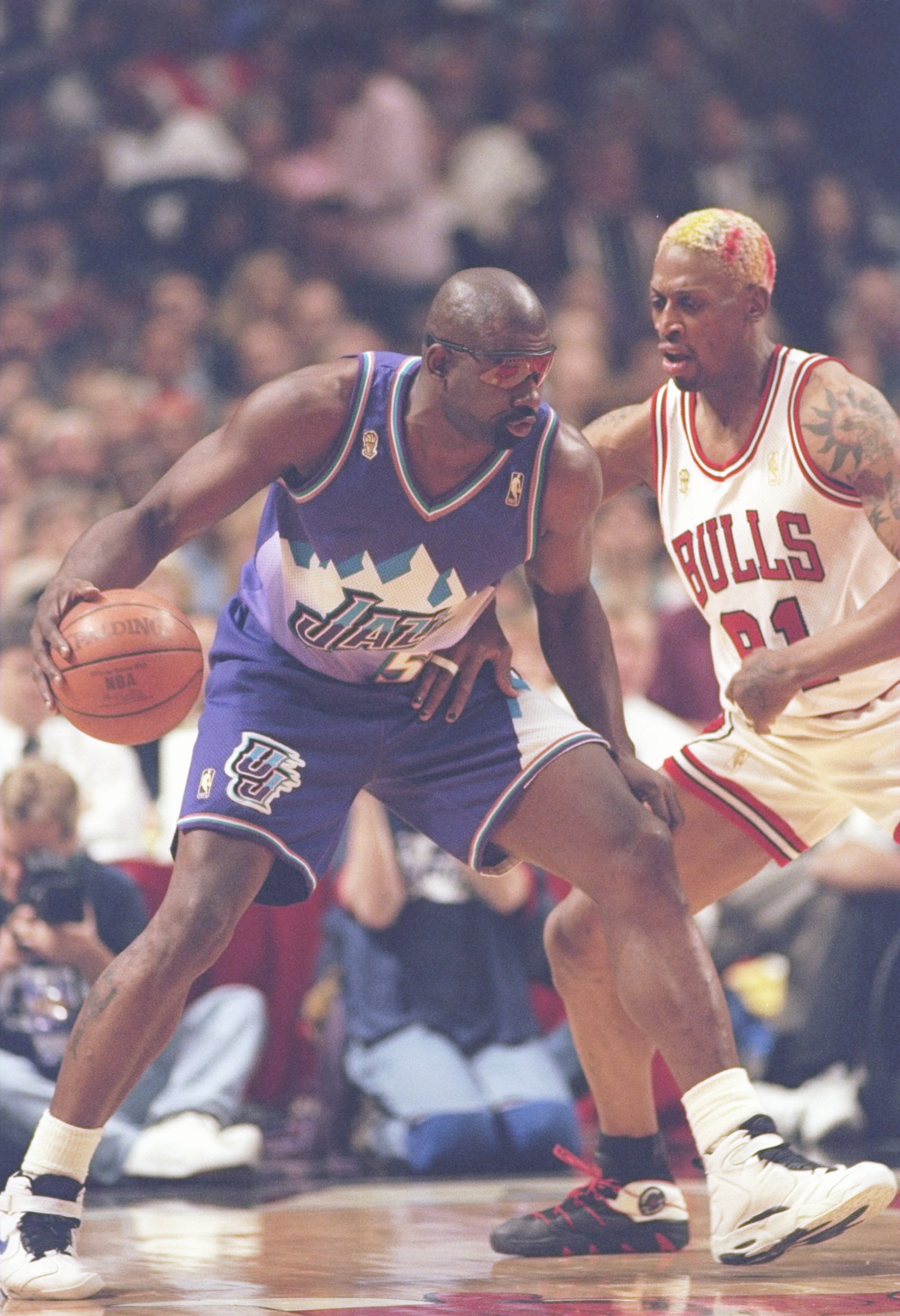 4 Jun 1997: Forward Antoine Carr of the Utah Jazz tries to drive past forward Dennis Rodman of the Chicago Bulls during a playoff game against the Utah Jazz at the United Center in Chicago, Illinois. The Bulls won the game 97-85.