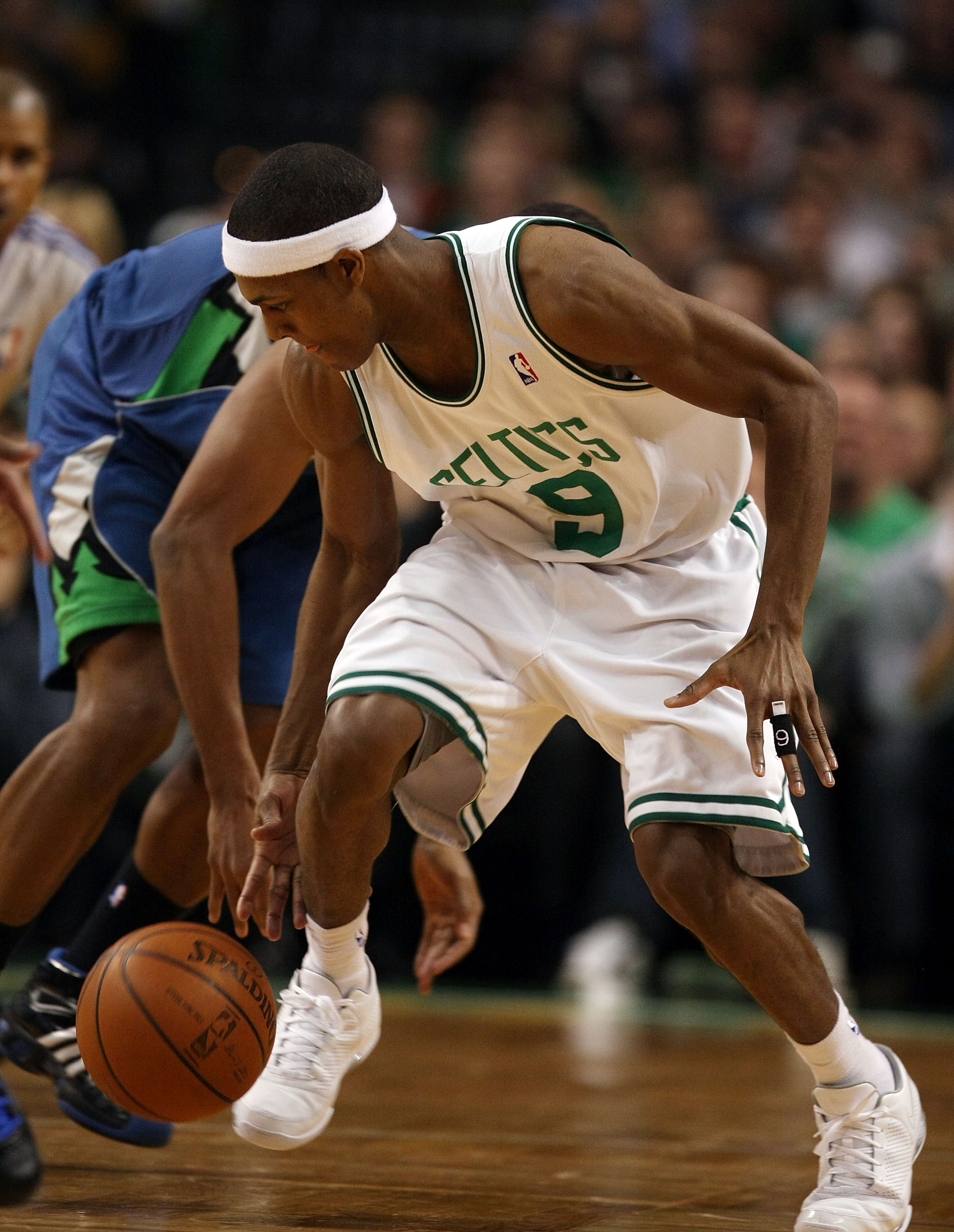 BOSTON - FEBRUARY 01:  Rajon Rondo #9 of the Boston Celtics steals the ball from Ryan Gomes #8 of Minnesota Timberwolves on February 1, 2009 at TD Banknorth Garden in Boston, Massachusetts. The Celtics defeated the Minnesota Timberwolves 109-101. NOTE TO