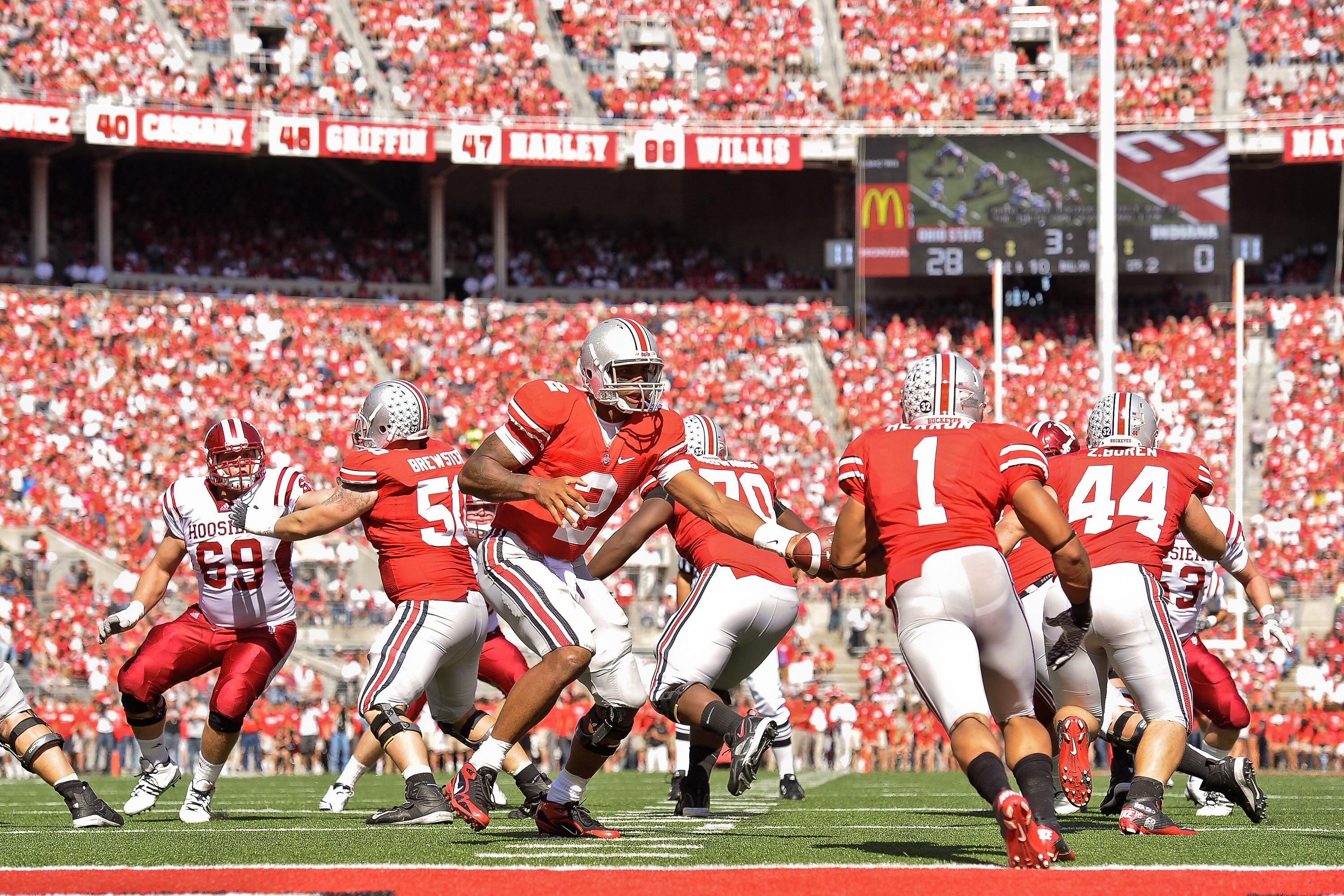 COLUMBUS, OH - OCTOBER 9:  Quarterback Terrelle Pryor #2 of the Ohio State Buckeyes hands off to Dan Herron #1 of the Ohio State Buckeyes  against the Indiana Hoosiers at Ohio Stadium on October 9, 2010 in Columbus, Ohio.  (Photo by Jamie Sabau/Getty Imag