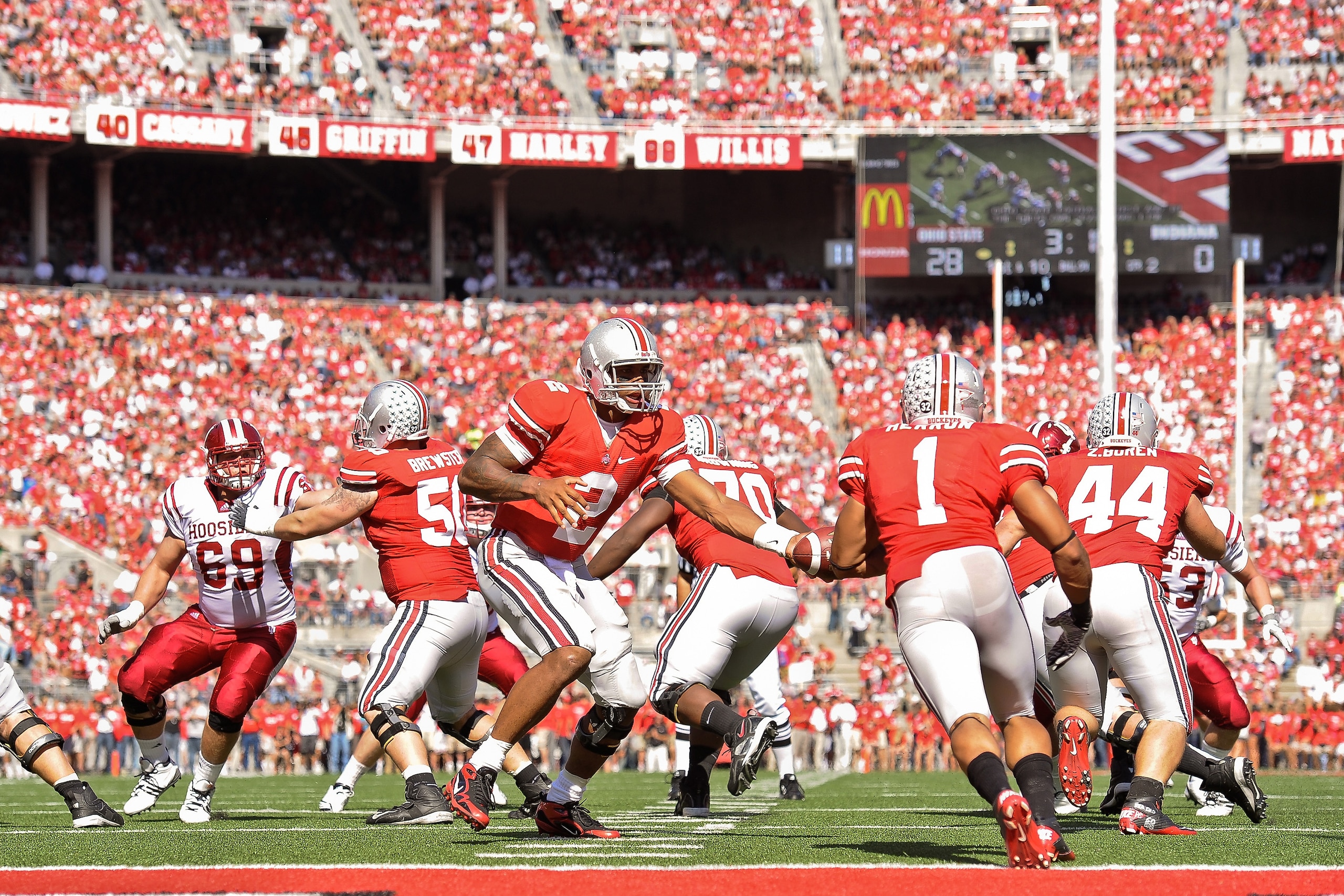 COLUMBUS, OH - OCTOBER 9:  Quarterback Terrelle Pryor #2 of the Ohio State Buckeyes hands off to Dan Herron #1 of the Ohio State Buckeyes  against the Indiana Hoosiers at Ohio Stadium on October 9, 2010 in Columbus, Ohio.  (Photo by Jamie Sabau/Getty Imag