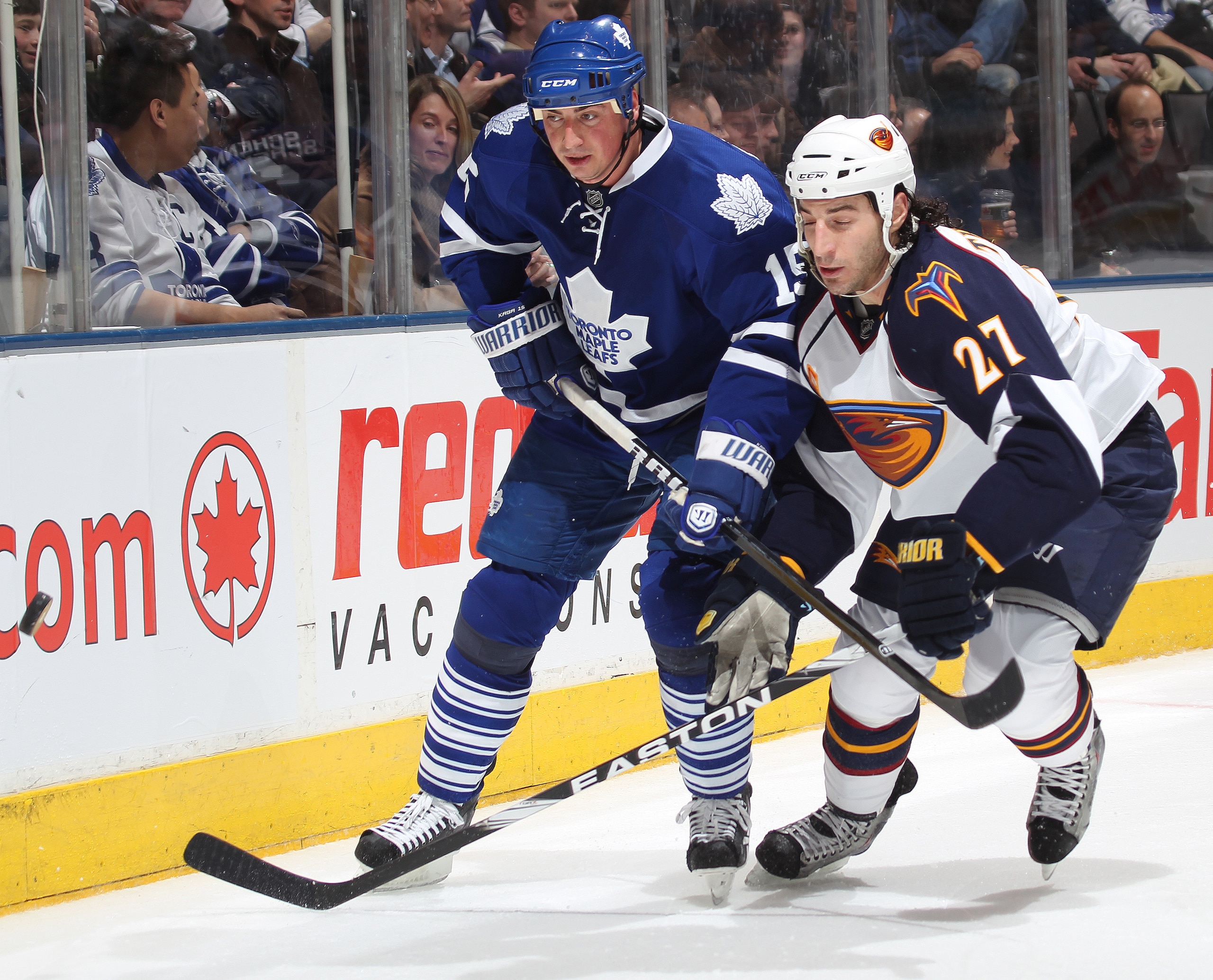TORONTO, CAN - FEBRUARY 7: Chris Thorburn #27 of the Atlanta Thrashers battles with Tomas Kaberle #15 of the Toronto Maple Leafs for puck posession in a game on February 7, 2011 at the Air Canada Centre in Toronto, Canada. The Leafs defeated the Thrasher TORONTO, CAN - FEBRUARY 7: Chris Thorburn #27 of the Atlanta Thrashers battles with Tomas Kaberle #15 of the Toronto Maple Leafs for puck posession in a game on February 7, 2011 at the Air Canada Centre in Toronto, Canada. The Leafs defeated the Thrasher