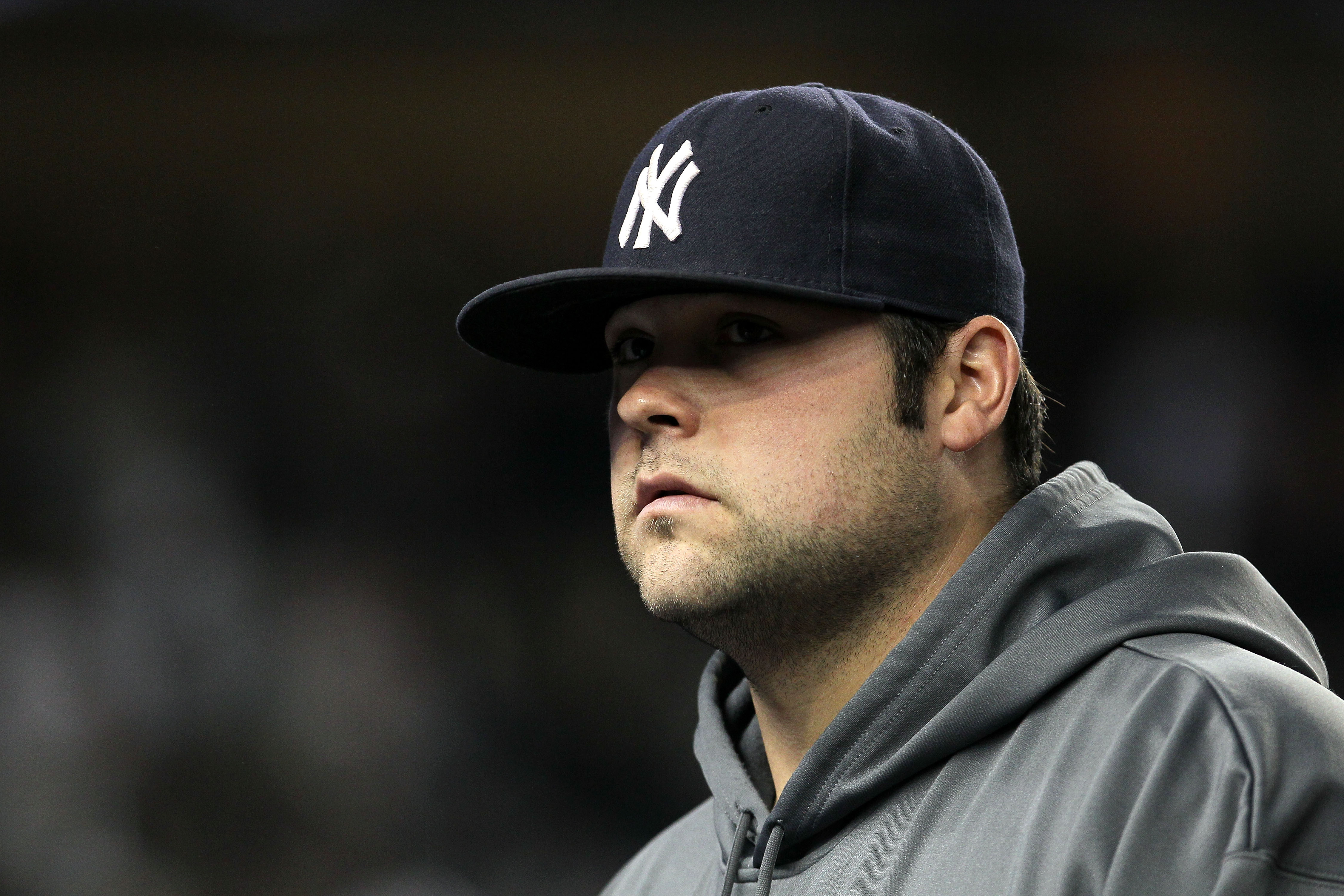 NEW YORK - OCTOBER 19:  Joba Chamberlain #62 of the New York Yankees looks on against the Texas Rangers in Game Four of the ALCS during the 2010 MLB Playoffs at Yankee Stadium on October 19, 2010 in the Bronx borough of New York City.  (Photo by Jim McIsa