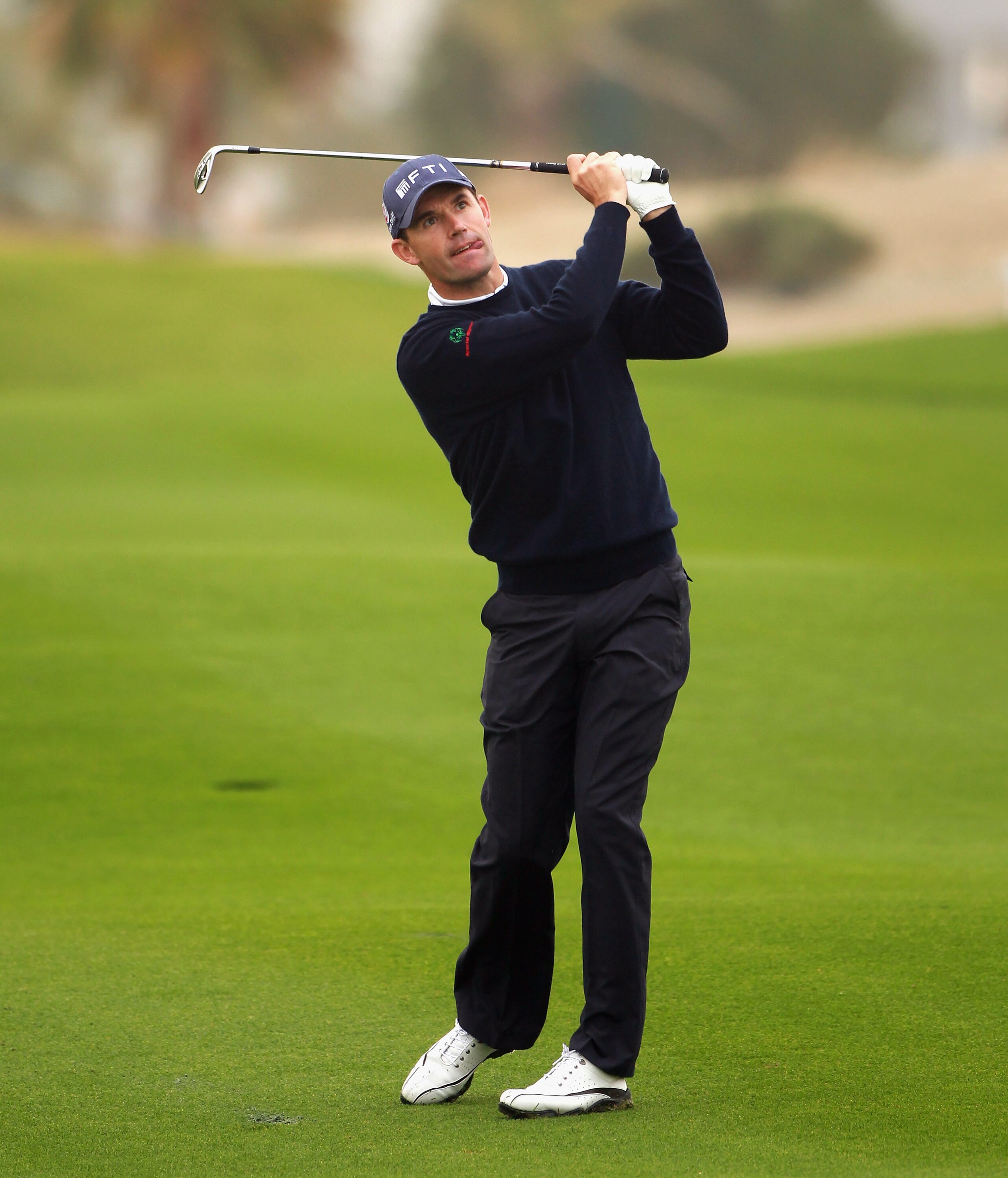 BAHRAIN, BAHRAIN - JANUARY 28:  Padraig Harrington of Ireland plays his second shot on the 11th hole during the second round of the Volvo Golf Champions at The Royal Golf Club on January 28, 2011 in Bahrain, Bahrain.  (Photo by Andrew Redington/Getty Imag