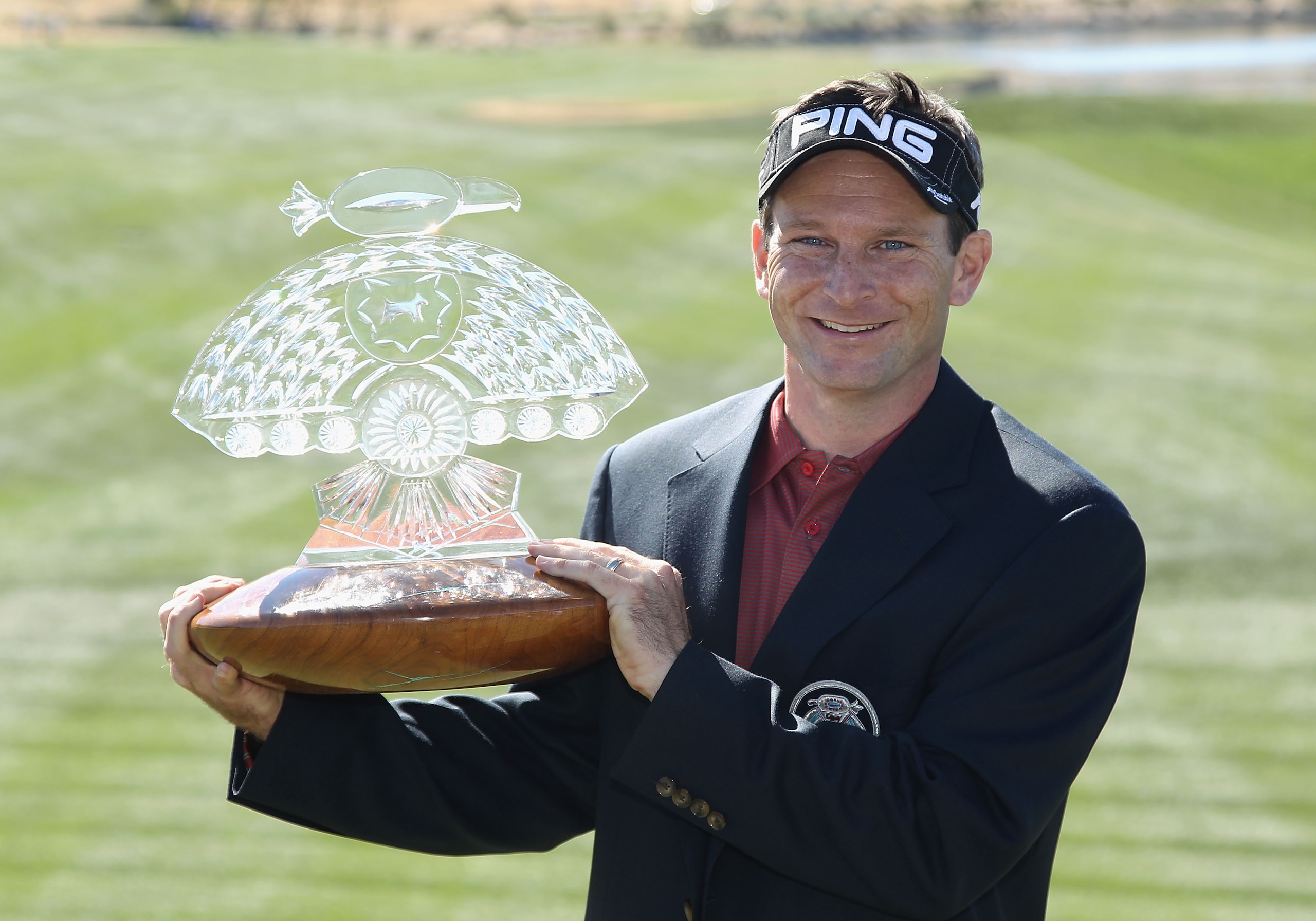 SCOTTSDALE, AZ - FEBRUARY 07:  Mark Wilson poses with the winner's trophy after defeating Jason Dufner (not pictured) in a two hole playoff to win the Waste Management Phoenix Open at TPC Scottsdale on February 7, 2011 in Scottsdale, Arizona.  (Photo by C