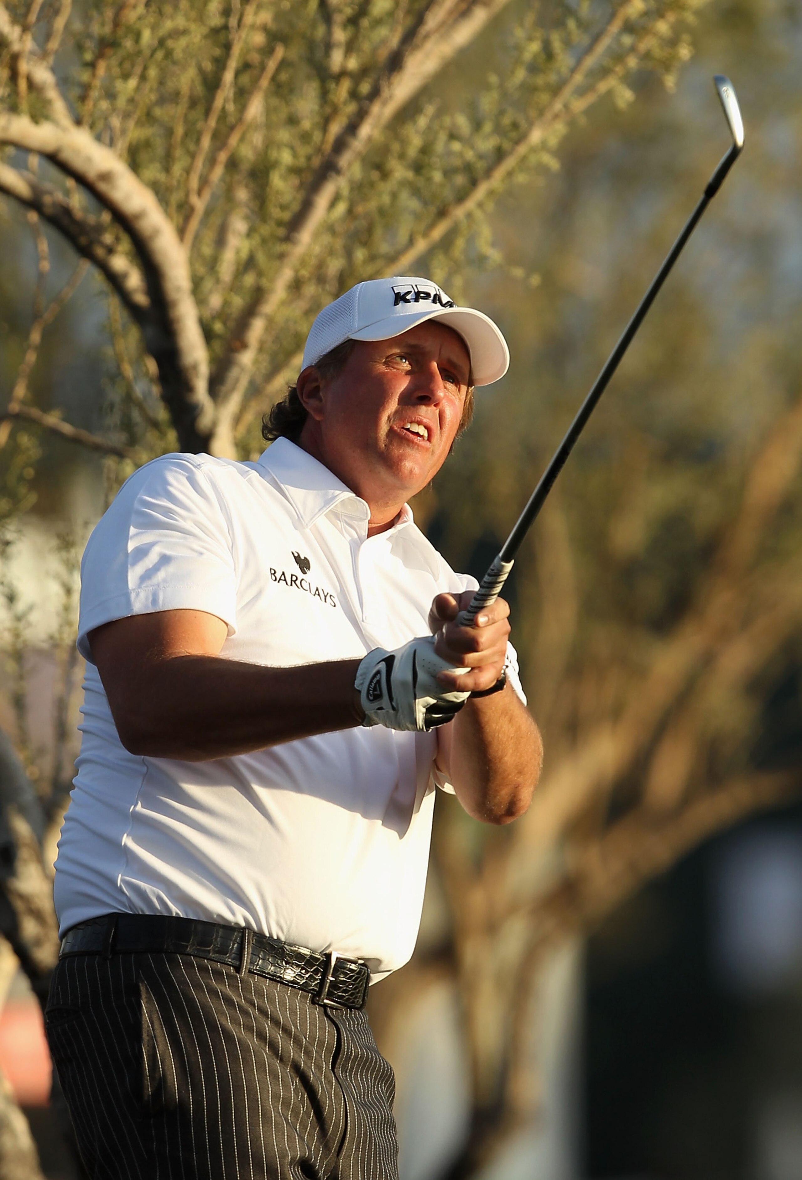 SCOTTSDALE, AZ - FEBRUARY 06:  Phil Mickelson hits his second shot on the 11th hole during the final round of the Waste Management Phoenix Open at TPC Scottsdale on February 6, 2011 in Scottsdale, Arizona.  (Photo by Christian Petersen/Getty Images)