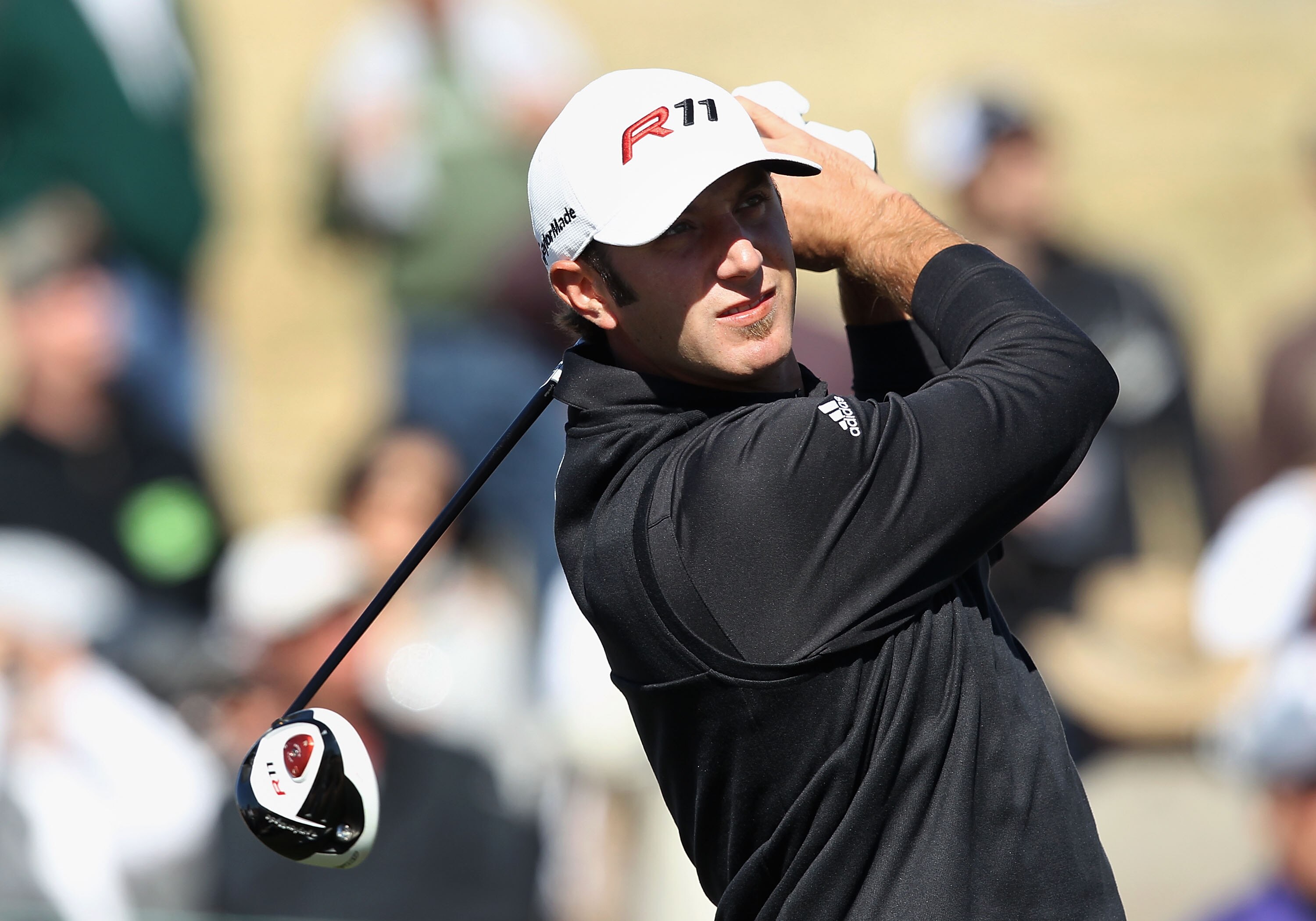 SCOTTSDALE, AZ - FEBRUARY 04: Dustin Johnson hits a tee shot on the 14th hole during the first round of the Waste Management Phoenix Open at TPC Scottsdale on February 4, 2011 in Scottsdale, Arizona. (Photo by Christian Petersen/Getty Images)