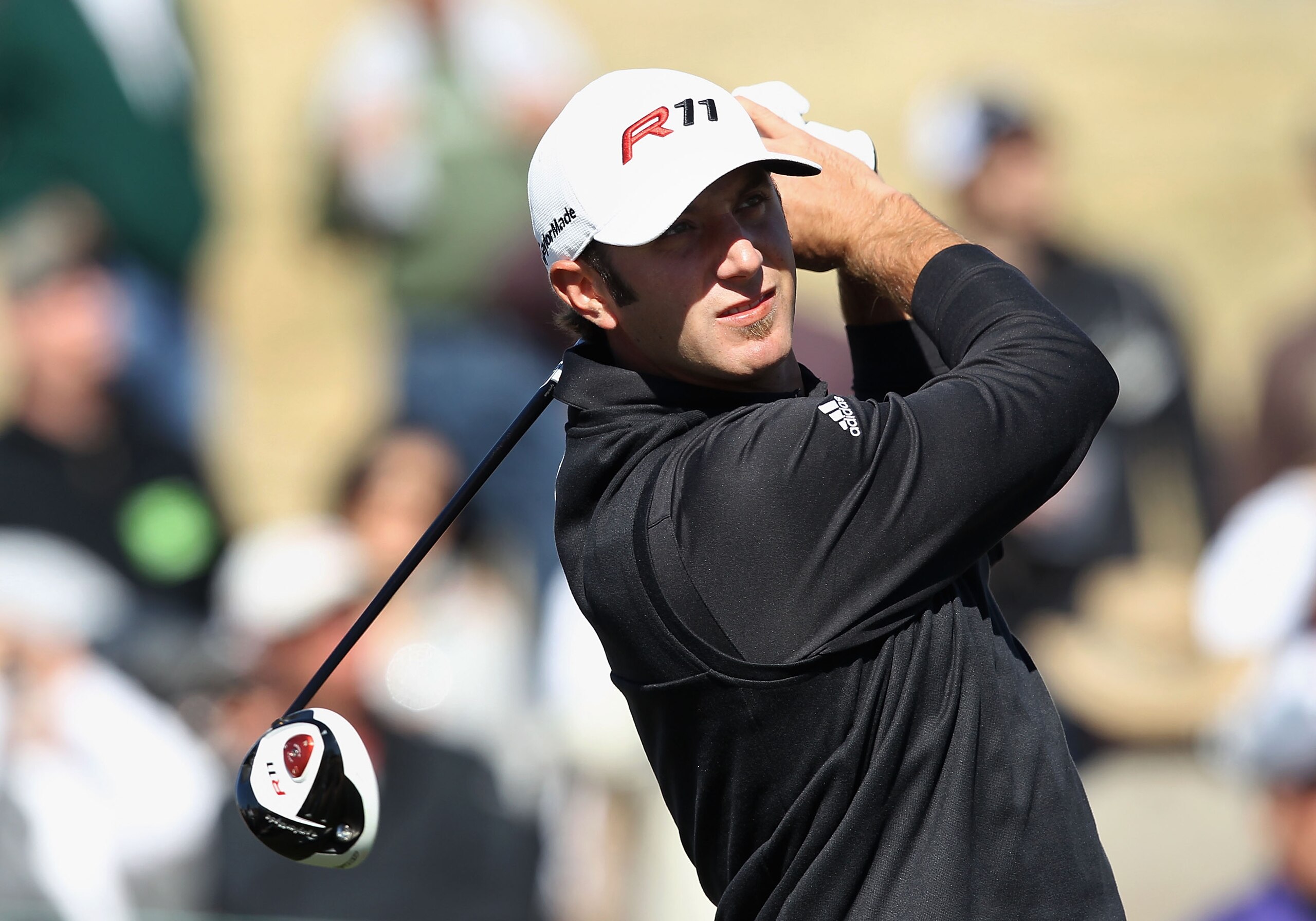 SCOTTSDALE, AZ - FEBRUARY 04: Dustin Johnson hits a tee shot on the 14th hole during the first round of the Waste Management Phoenix Open at TPC Scottsdale on February 4, 2011 in Scottsdale, Arizona. (Photo by Christian Petersen/Getty Images)