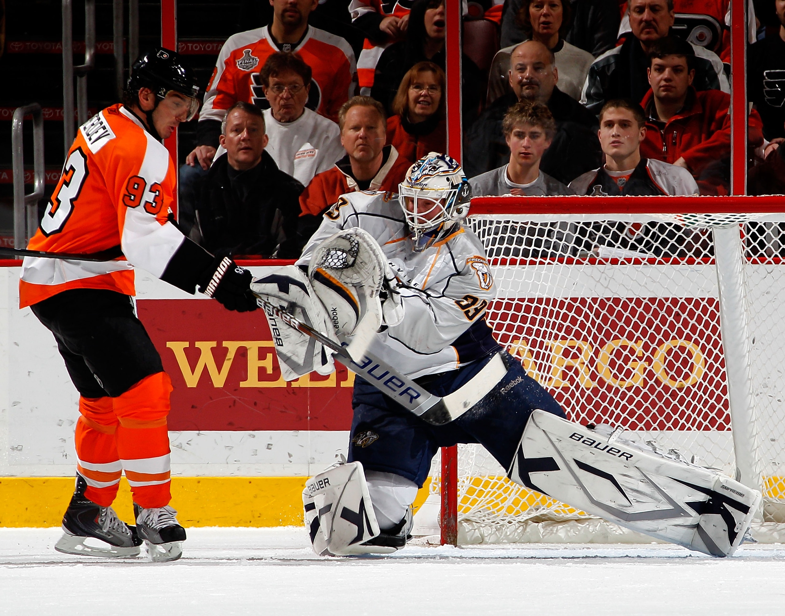 PHILADELPHIA, PA - FEBRUARY 03:  Goalie Anders Lindback #39 of the Nashville Predators stops the puck on a tip in attempt by Nikolay Zherdev #93 of the Philadelphia Flyers during the first period of an NHL hockey game at the Wells Fargo Center on February