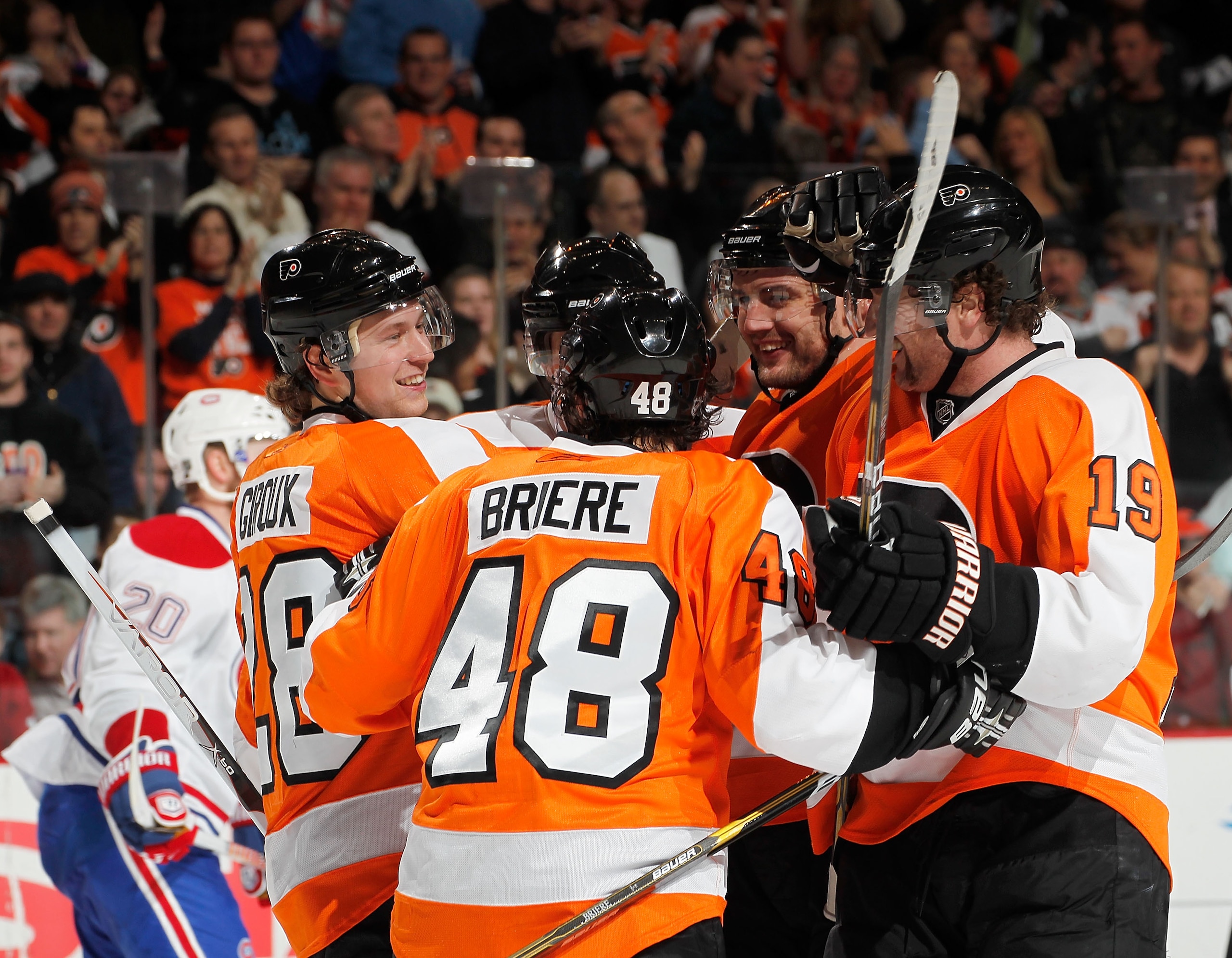 PHILADELPHIA, PA - JANUARY 25:  Claude Giroux #28 of the Philadelphia Flyers celebrates his second period goal with his teammates in an NHL hockey game against the Montreal Canadiens at the Wells Fargo Center on January 25, 2011 in Philadelphia, Pennsylva