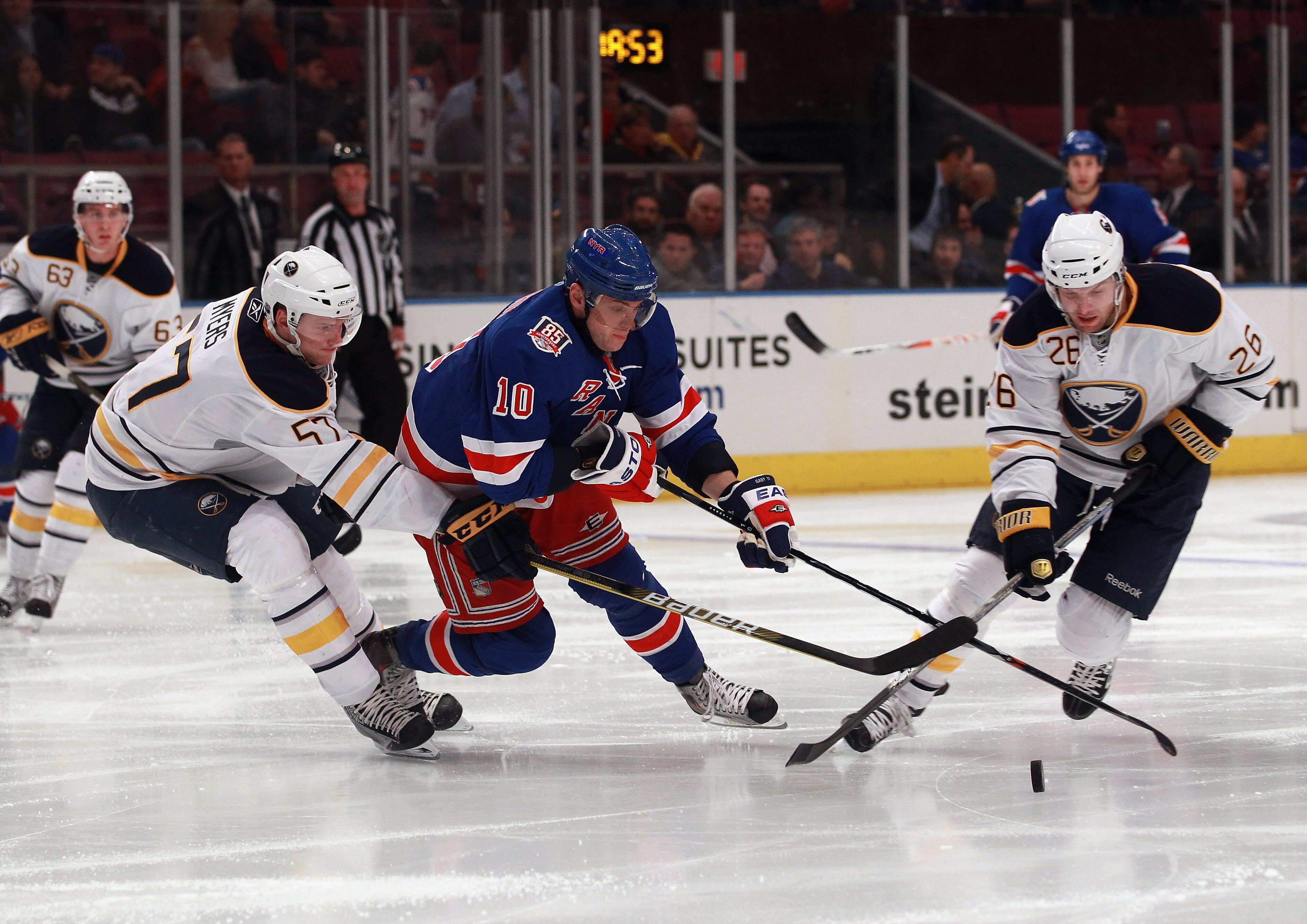 NEW YORK - NOVEMBER 11:  Tyler Myers #57 and Thomas Vanek #26 of the Buffalo Sabres trip up Marian Gaborik #10 of the New York Rangers at Madison Square Garden on November 11, 2010 in New York City.  (Photo by Bruce Bennett/Getty Images)