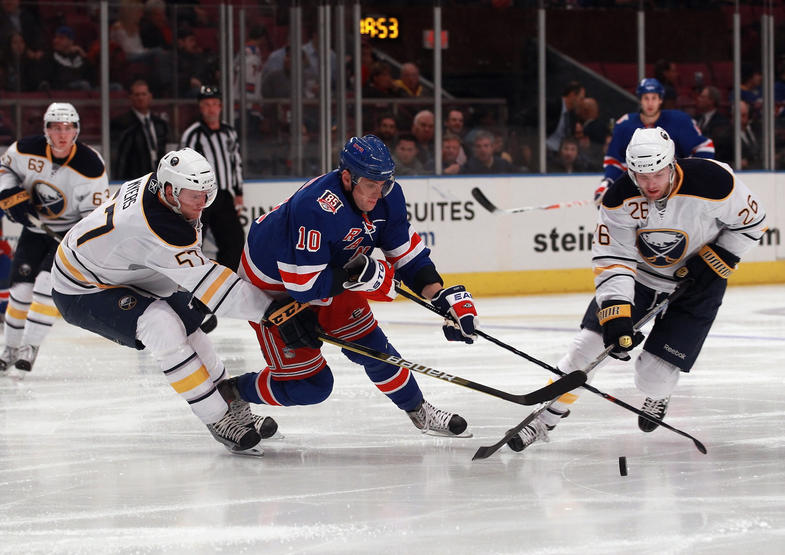 NEW YORK - NOVEMBER 11:  Tyler Myers #57 and Thomas Vanek #26 of the Buffalo Sabres trip up Marian Gaborik #10 of the New York Rangers at Madison Square Garden on November 11, 2010 in New York City.  (Photo by Bruce Bennett/Getty Images)