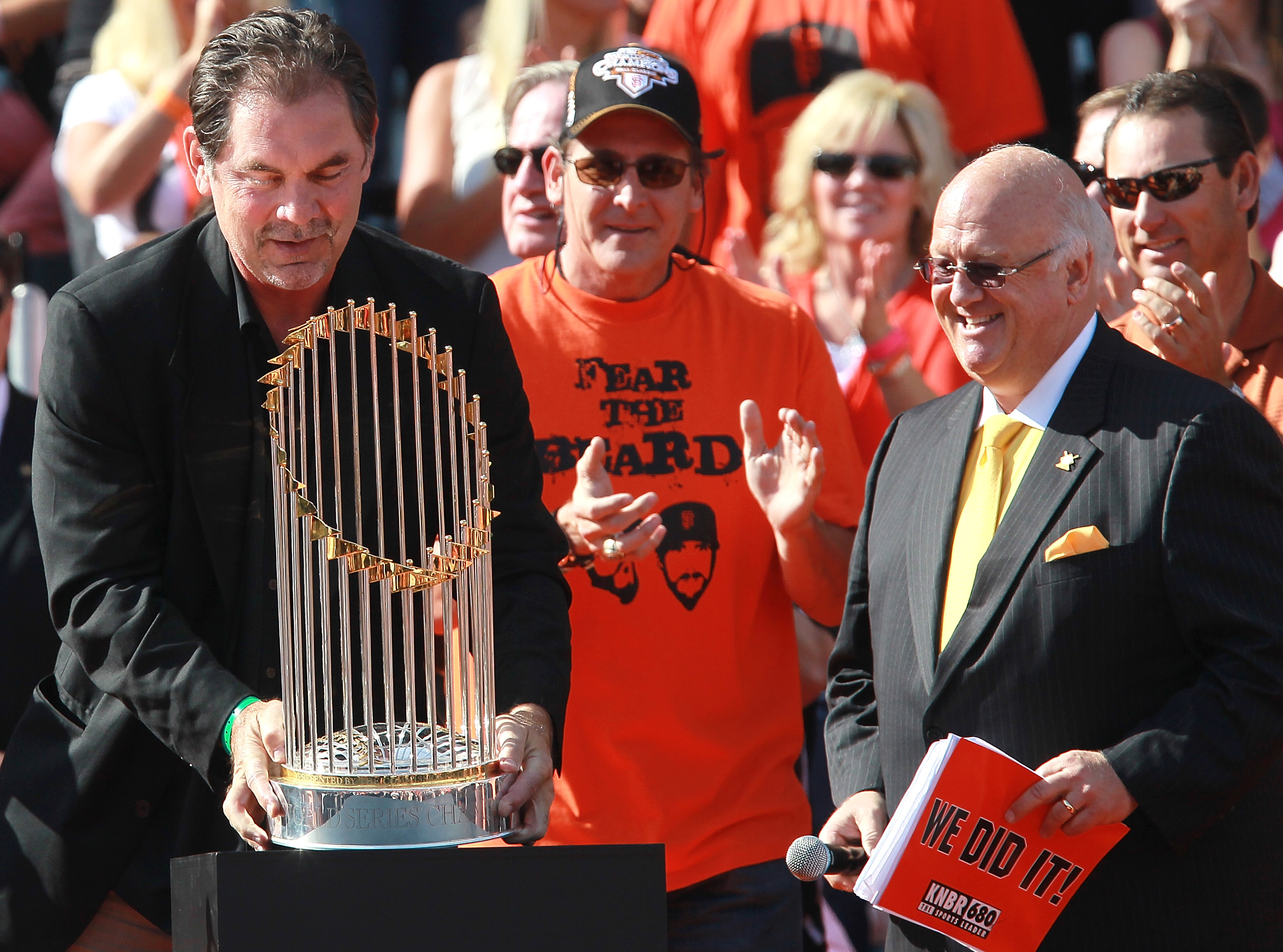 SAN FRANCISCO - NOVEMBER 03:  San Francisco Giants manager Bruce Bochy (L) carries the World Series trophy at the conclusion of the Giants' victory parade on November 3, 2010 in San Francisco, California. Thousands of Giants fans lined the streets of San 