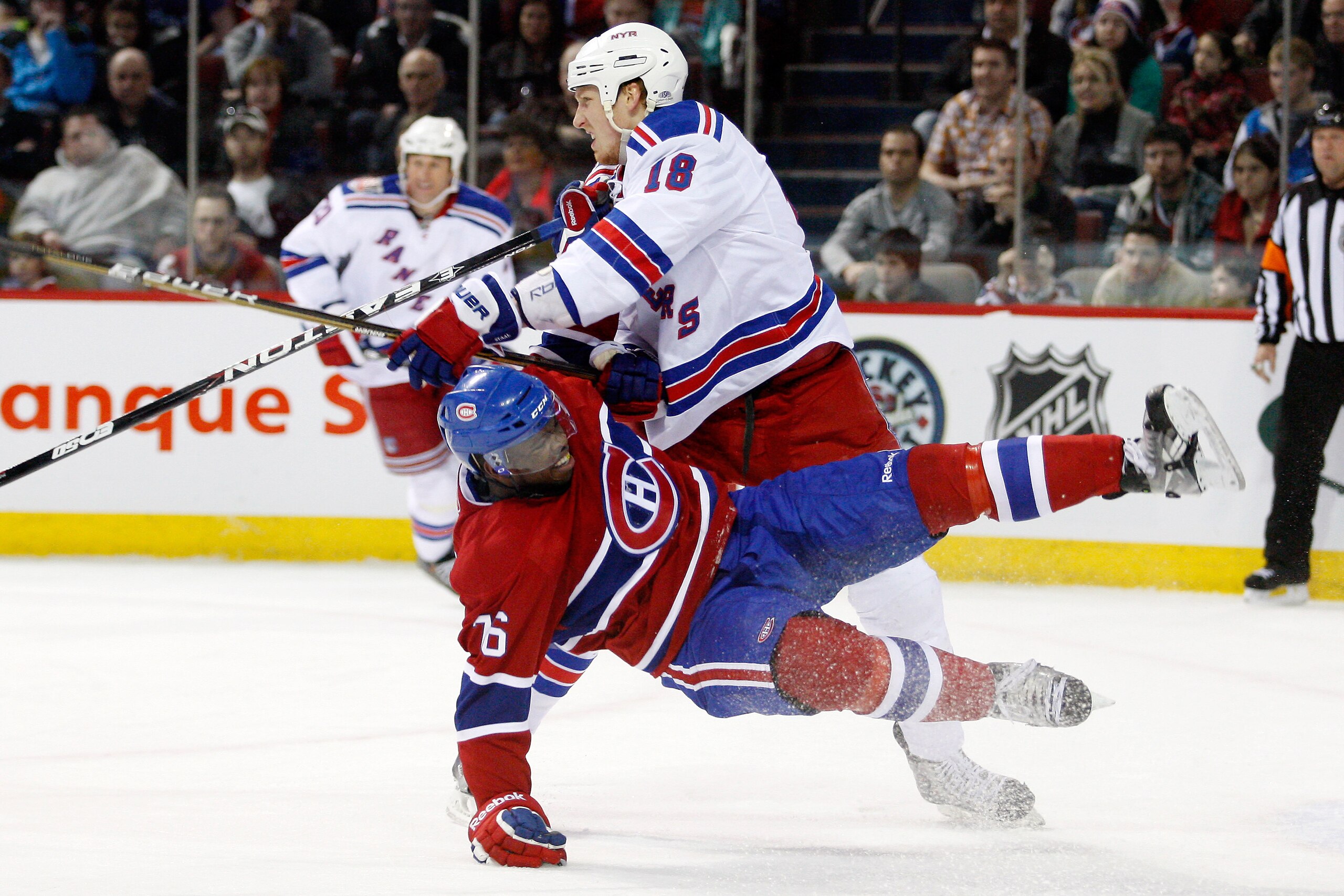 MONTREAL, CANADA - FEBRUARY 5:  Marc Staal #18 of the New York Rangers sends P.K. Subban #76 of the Montreal Canadiens to the ice during the NHL game at the Bell Centre on February 5, 2011 in Montreal, Quebec, Canada.  (Photo by Richard Wolowicz/Getty Ima