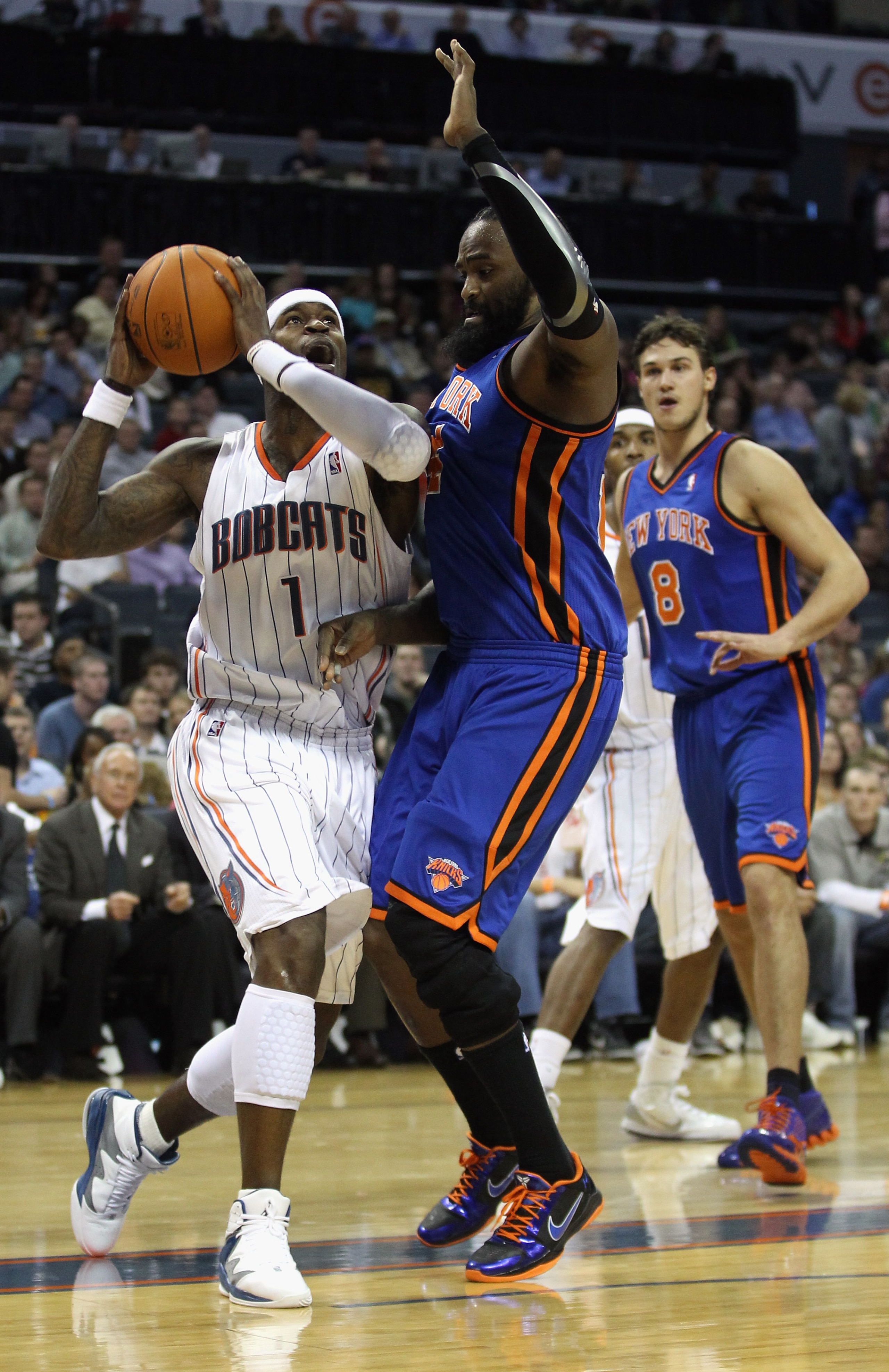 CHARLOTTE, NC - NOVEMBER 24:  Ronny Turiaf #14 of the New York Knicks tries to stop Stephen Jackson #1 of the Charlotte Bobcats during their game at Time Warner Cable Arena on November 24, 2010 in Charlotte, North Carolina.  NOTE TO USER: User expressly a