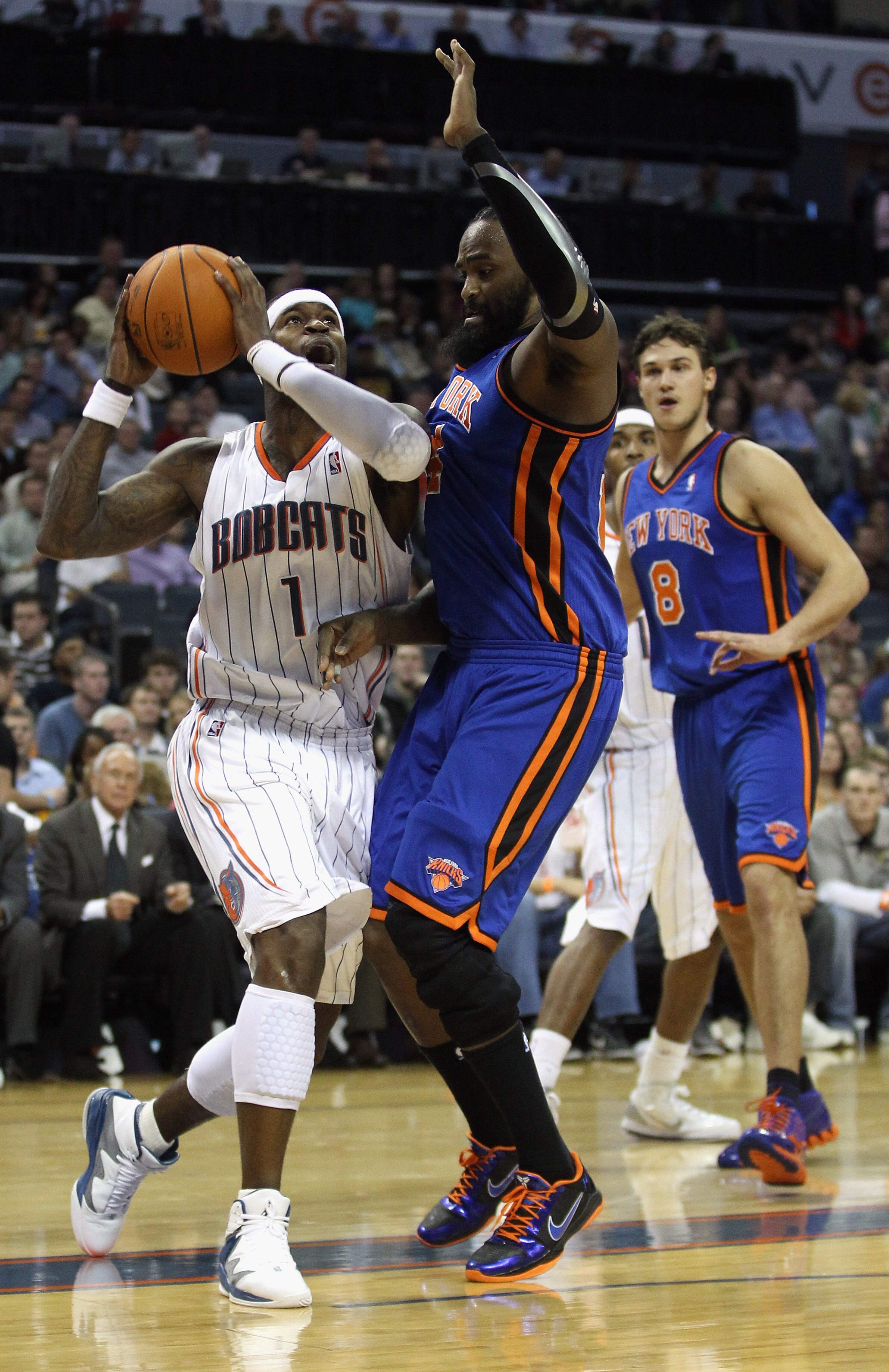 CHARLOTTE, NC - NOVEMBER 24:  Ronny Turiaf #14 of the New York Knicks tries to stop Stephen Jackson #1 of the Charlotte Bobcats during their game at Time Warner Cable Arena on November 24, 2010 in Charlotte, North Carolina.  NOTE TO USER: User expressly a
