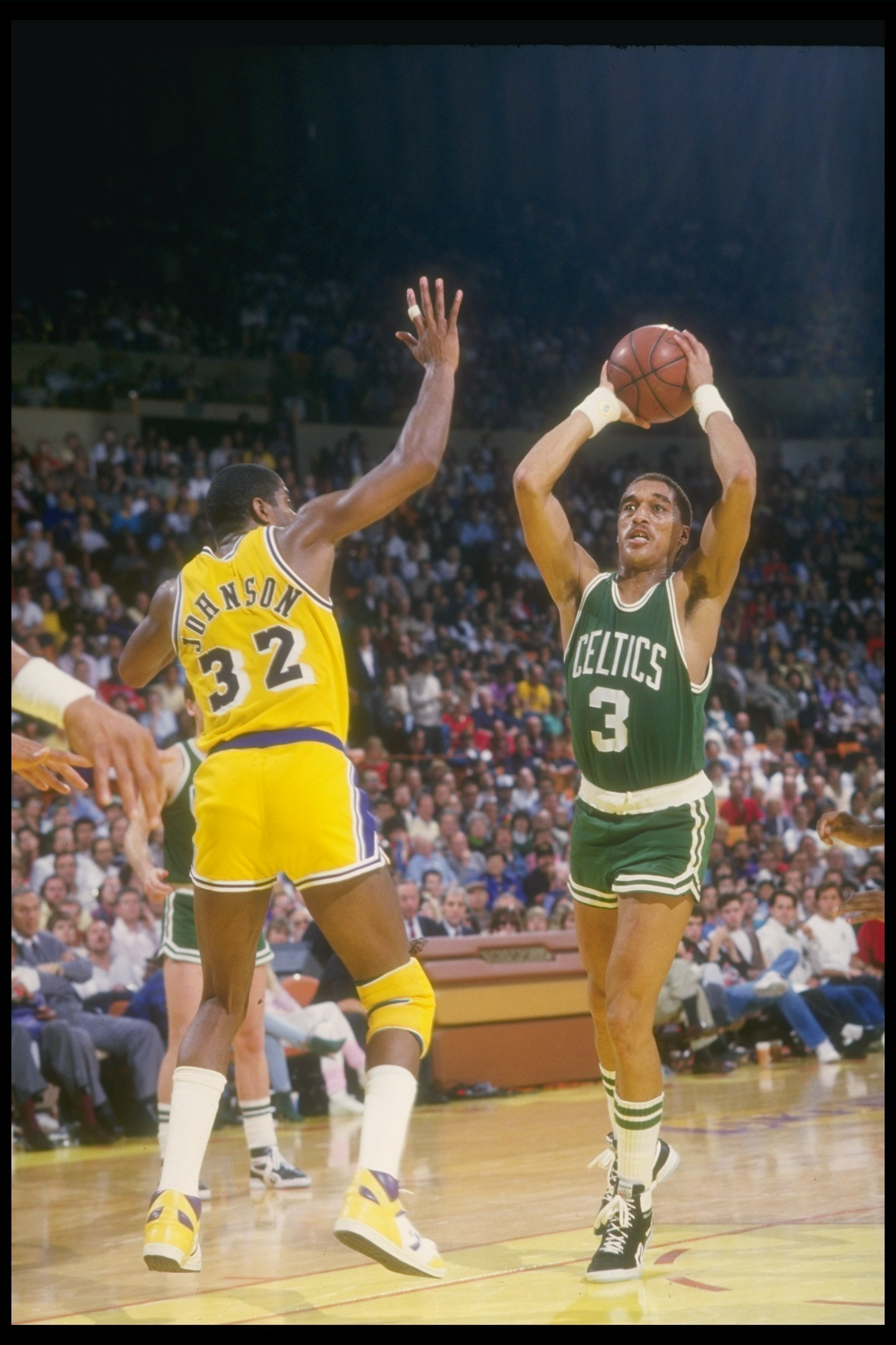 Oct 1989:  Guard Dennis Johnson of the Boston Celtics looks to pass the ball during a game against the Los Angeles Lakers at the Great Western Forum in Inglewood, California. Mandatory Credit: Rick Stewart  /Allsport